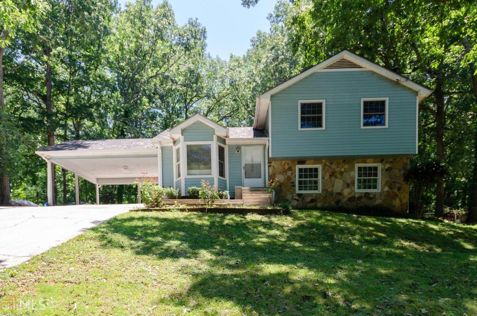 FANTASTIC OPPORTUNITY to get into a nice home in a good Gwinnett County school district! BRAND NEW HVAC!!! This private lot in a community with NO HOA allows you the chance to park boats, RV’s, work trucks and trailers in the privacy of your own yard! Inside is a quaint living room and eat-in kitchen on the main level, 3 bedrooms and 2 full baths upstairs and a family room/den with a fireplace in the lower level as well as an additional room that could be a 4th bedroom. The lower level room also contains plumbing which could also make it a 3rd bathroom or workshop. The possibilities are only limited by your imagination! At this price point you won’t find a better value for the area! REDUCED PRICE!!!