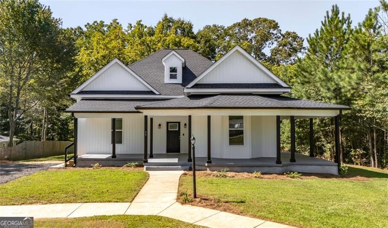 Welcome to 75 Rose Street - a beautifully remodeled Victorian Ranch. 3-bedroom, 2-bath home with soaring 12 ft ceilings and modern updates throughout. Every detail has been thoughtfully redone, including: Gorgeous refurbished hardwood floors plus new carpet and LVP. Fully renovated kitchen with quartz counter tops, a huge island, brand new appliances, and a walk-in pantry. Renovated bathrooms featuring new vanities, cabinets, fixtures, and toilets including a spacious owner's suite bathroom with a large vanity and linen closet. All new systems & finishes: new roof, HVAC, smart water heater, windows, exterior doors, paint, lighting, and fixtures throughout. Smart features: Ring camera for added peace of mind Enjoy the open-concept layout perfect for entertaining, a separate laundry room, and a brand-new rear deck overlooking the large backyard with a powered storage shed and gorgeous mature black walnut trees. This move-in ready ranch blends classic charm with modern upgrades-truly a must-see! Seller offering $5,000 in closing costs or seller concessions.