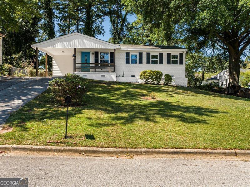 This charming, newly remodeled ranch offers 3 bedrooms and 2 bathrooms, designed with comfort and style in mind. The home features new floors throughout, beautifully updated tile bathrooms, and an open-concept kitchen with quartz countertops extended for seating and a clear view into the living room. The back deck overlooks the spacious, cleared backyard, perfect for creating your own outdoor retreat. This move-in-ready home combines modern updates with inviting spaces, making it a wonderful place to call home.