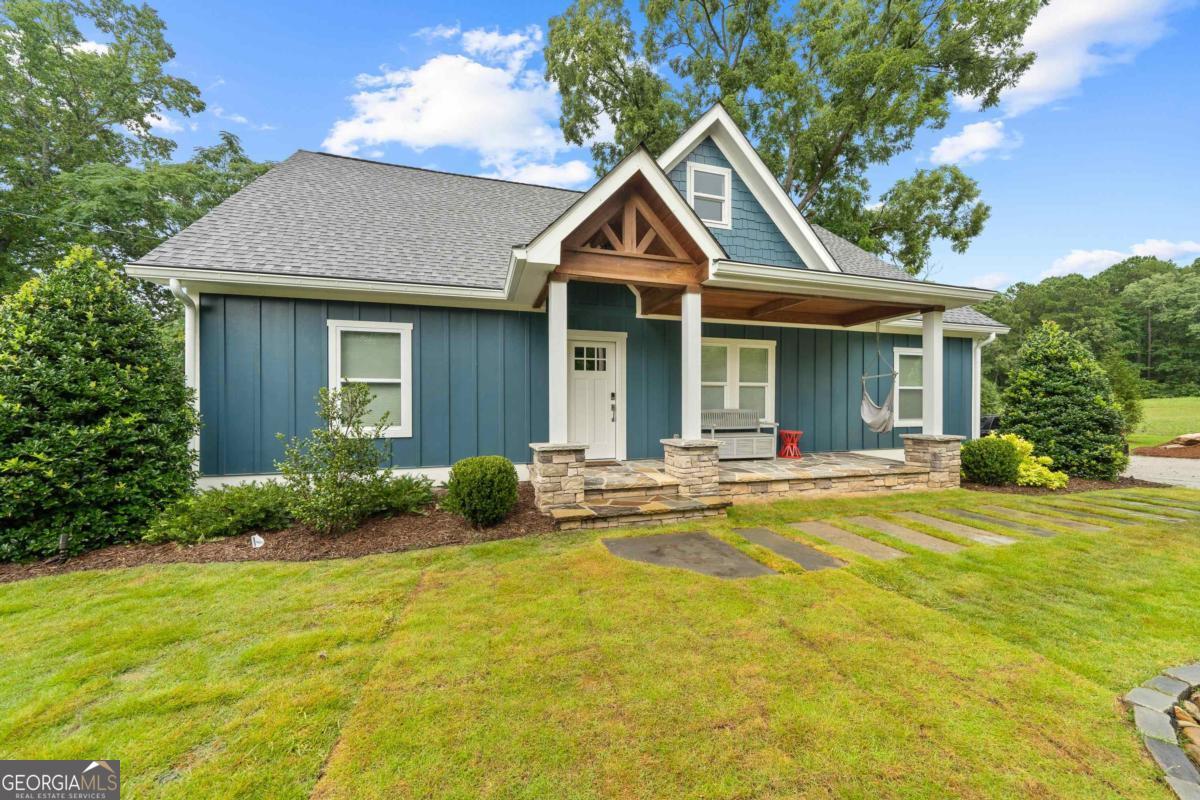 Charming Fully Remodeled Ranch on 1.5 Acres - Your Private Oasis Awaits! Step into this beautifully updated ranch-style home featuring 3 spacious bedrooms and 2.5 modern bathrooms. The entire house has been thoughtfully remodeled, boasting gorgeous wood floors and a sleek, modern kitchen equipped with stainless steel appliances - perfect for both everyday living and entertaining. Set on a generous 1.5-acre lot, enjoy serene outdoor living with a stunning waterfall in the front yard and a tranquil koi pond in the backyard. Gather around the cozy firepit with a custom stone bench for memorable evenings under the stars. Cool off in the above-ground pool on warm days or retreat to the charming she shed-ideal for a quiet workspace or personal getaway. The property also includes a rare four-bay garage, providing ample space for vehicles, storage, or hobbies. Don't miss the opportunity to own this peaceful and picturesque home - a true sanctuary that blends modern comfort with natural beauty.