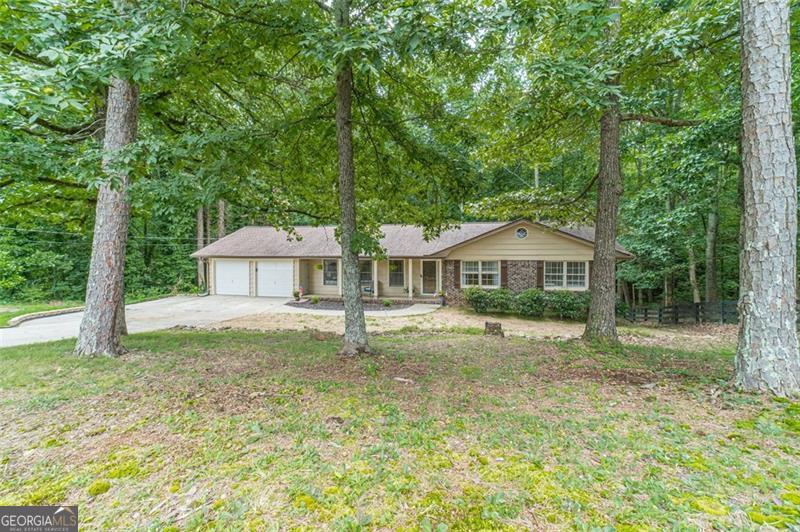 Beautifully Updated All-Brick Ranch in Buford City School District Discover this meticulously refreshed 4-sided brick ranch, blending rustic-modern design with classic appeal in the highly desirable Buford City School District. This welcoming home offers 3 spacious bedrooms and 2 full bathrooms on the main level, plus a daylight walkout basement with a third full bath-ideal for entertaining, guest space, or additional storage. The modern kitchen features granite countertops, new Samsung stainless steel appliances, and stylish rustic-modern accents that add warmth and character. Throughout the home, luxury vinyl plank flooring provides durability and a sleek, cohesive look. Step outside onto the large back deck overlooking your private backyard oasis, perfect for outdoor gatherings and relaxation. Set on just under half an acre, the level backyard backs to a peaceful creek and mature trees, offering a tranquil outdoor retreat. Located just minutes from shopping, dining, the Mall of Georgia, Buford Town Green, and major routes, this home combines comfort, style, and convenience in one exceptional package. Schedule your showing today and experience all this charming home has to offer!
