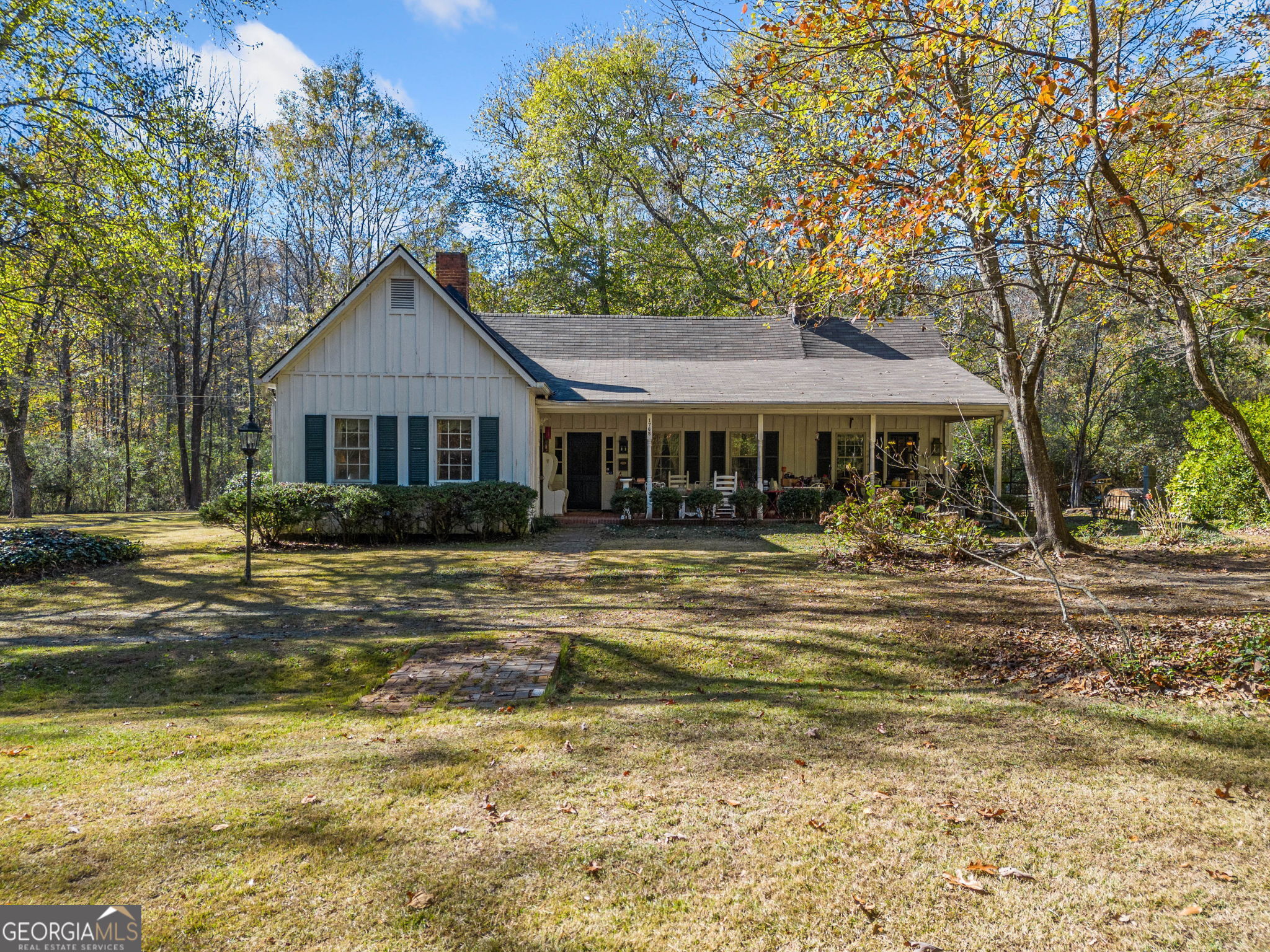 Beautiful 1940's Farmhouse on 6.85 Acres. Enjoy the true sanctuary of country living with Sewell Mill Creek meandering through the property and hardwood trees around home offering privacy. Excellent location only 10 miles to Atlanta city limits and in the sought-after Pope High School District & close to Shopping, Restaurants, Schools & Churches. Huge covered front porch offers ideal space for rocking chairs and porch swings. Home features true farmhouse details with 10' Ceilings, Sun Porch, Wide-Plank Wood Floors, Solid Wood Doors, Vintage Hardware & Fixtures, Shiplap Walls & Ceilings, Built in Bookshelves & 3 Fireplaces with Hand-carved Mantels. Areas for future pastures so bring your horses and chickens. Zoned R-30.