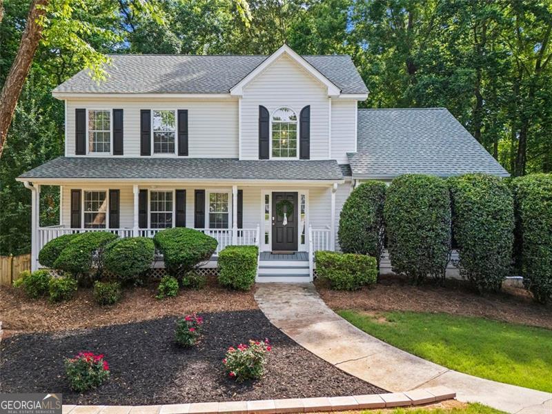 Nestled on a quiet cul-de-sac in Cumming's sought-after Woodberry subdivision, this beautiful home offers an ideal blend of comfort and style in the excellent North Forsyth school district. Step inside to a great room with hardwood flooring, cathedral ceilings and stone fireplace focal point. The kitchen features stunning quartz countertops, a modern undermount stainless farmhouse sink, stainless appliances, island, white subway tile backsplash and a large, sunny eat-in area. The primary suite is located on the main level, complete with LVP flooring, tray ceilings, and a spacious bathroom offering a double vanity and a separate tub and shower. Upstairs, you'll find 2 large secondary bedrooms with large closets and a full bathroom. The partially finished basement adds incredible flexibility with a fourth bedroom or flex space and is already stubbed for a future bath. Entertain or unwind on the huge deck that overlooks a private, fenced backyard on a generous half-acre lot. The Woodberry Community offers fantastic swim community amenities and is close to dining, shopping, and schools!