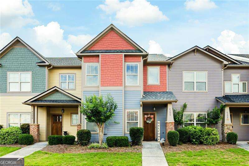 This stunning craftsman-style townhome sits in the sought-after gated community of Lake Acworth Village. The main level boasts a private entry foyer, beautiful hardwood floors and an open layout. The spacious, sunlit family room has a stone fireplace and flows seamlessly into the kitchen and dining area. The kitchen features stained cabinets, granite countertops, a breakfast bar, stainless steel appliances, a pantry and an eat-in dining space. The luxurious master suite is a retreat, showcasing a tray ceiling, a generous walk-in closet, and a spa-like ensuite with a double vanity and separate shower and bath tub. The second bedroom is equally impressive with a large closet, and its own full bath with a tub-shower combo. Both bathrooms have tile flooring and granite countertops. A convenient upstairs laundry sits in between the two bedrooms. This townhome boasts an abundance of closet space throughout, plus the added convenience of a garage, additional driveway space and spacious storage room. ROOF is less than 6 months old! Enjoy the ease of maintenance-free living with HOA perks that include care of common areas, a playground, a pool and clubhouse (steps away), dwelling exterior & grounds maintenance, pest and termite control, plus water and sewer utilities. Located just minutes from I-75, Downtown Acworth, Lake Acworth, and Lake Allatoona, you'll have access to parks, scenic trails, and a variety of local dining and shopping options. Check out the Farmrs Market schedule, Taste of Acworth, etc because you will be a valued part of the booming Community of Downtown Acworth.