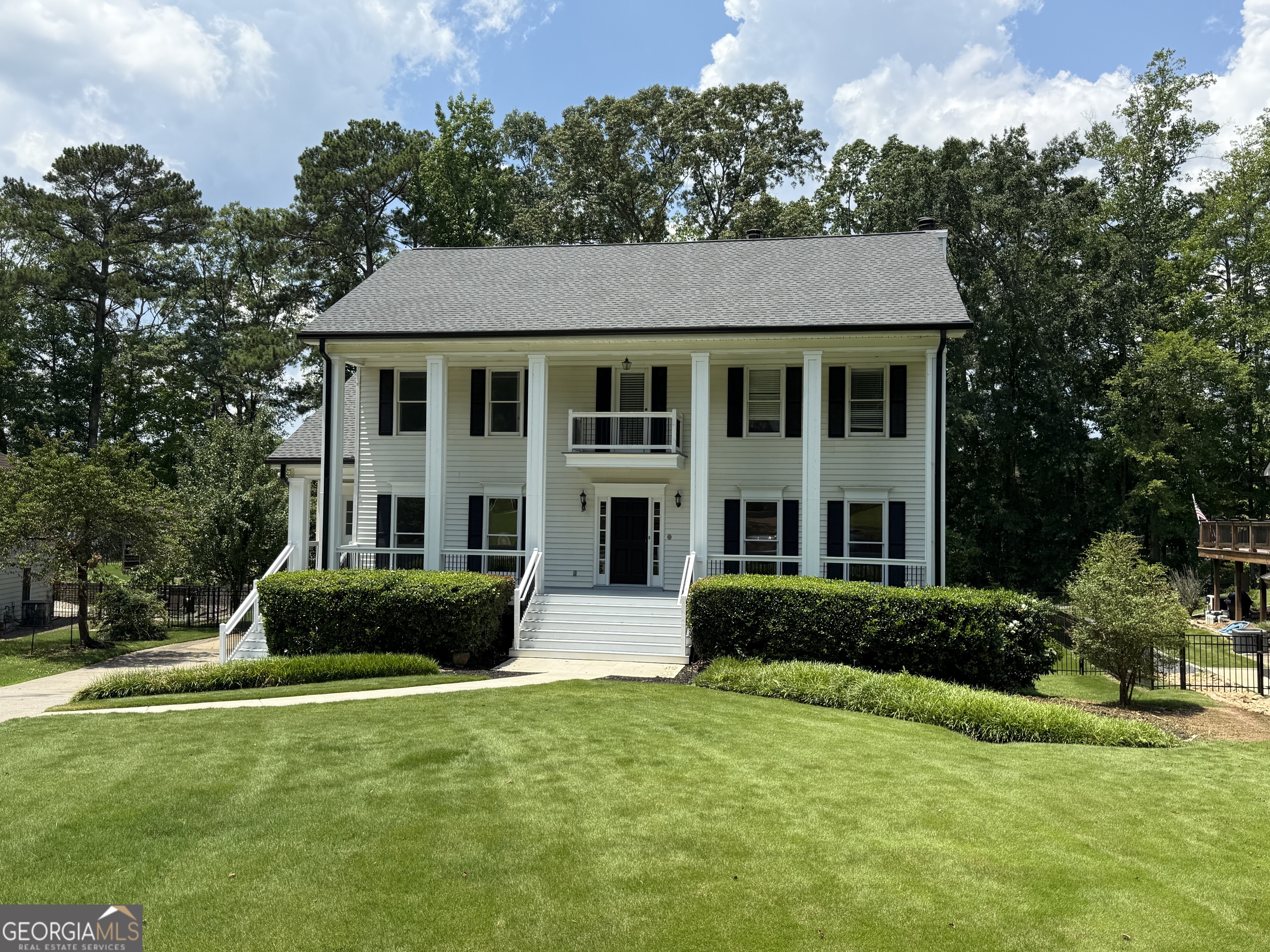 Lakefront Living Meets Everyday Luxury on Lake Peachtree! Welcome to your personal lakeside retreat-located on one of the largest lots in the neighborhood and backing directly onto the shimmering beauty of Lake Peachtree. This home offers more than a view-it's a lifestyle. Start your mornings on the brand-new back porch, sipping coffee while the lake glistens in the sunlight. Just beyond your backyard fence lies direct access to Peachtree City's iconic 100+ miles of golf cart paths-perfect for sunset rides, lakeside walks, and quick trips into town. And when July 4th rolls around, your own backyard becomes the ultimate VIP spot for the city's fireworks show-no traffic, no parking battles, just pure lakeside magic. Inside, this 4-bedroom, 2.5-bath home is move-in ready and full of charm, with key updates already completed: * New roof, gutters, and dual HVAC systems (2023) * New fenced backyard-ideal for pets or a future pool (2023) * New front and back porches (2024) * New garage doors & openers (2025) * Fresh interior paint and brand-new carpet (June 2025) The primary suite is a dream: featuring a cozy fireplace, expansive walk-in closet, a luxurious ensuite bath, and your very own private sauna-perfect for unwinding in comfort and style. The main living room offers more than warmth-it's a space to gather and relax with a beautiful fireplace framed by custom built-in bookshelves, adding both charm and function. And don't miss the original hardwood floors -they bring character, warmth, and timeless appeal. There is an additional fireplace in the walkout basement, which is already stubbed for a bathroom and kitchenette, ready to become an in-law suite, teen lounge, or your ultimate game or movie room. Whether you're drawn to the peaceful lakefront setting, the vibrant Peachtree City golf cart lifestyle, or the home's endless potential for luxury upgrades, this property delivers space, comfort, and charm in every direction. Come discover the lifestyle you've been dreaming of!