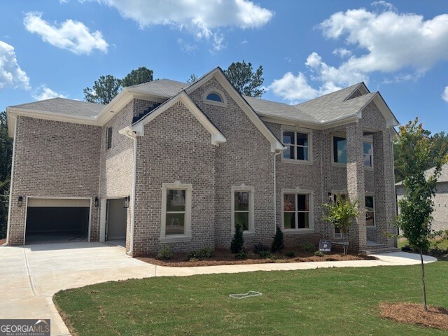 The Elliott floor plan features 5 bedrooms/ 4 baths and a three-car garage. On the main level is a formal living room, dining room, 2-story family room with coffered ceilings, kitchen cabinets with granite counter tops, tile backsplash, an oversized island, pantry, gourmet stainless steel appliances, hardwood floors, and a bedroom with a full bath. Stairs with oak handrails and wrought iron spindles lead upstairs. The second floor features an enormous primary suite with a sitting room, three secondary bedrooms, and two full baths.