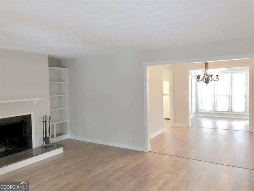 Top floor unit. No footsteps to listen to! Rare, oversized, light-filled 2-bedroom condo in Swim/Tennis community in East Cobb. Large living room with decorative fireplace, flanked by bookshelves. Separate dining room open to the living room, sunroom and kitchen, creating an open feel while allowing daylight to flow through the unit. Sunroom with access to a private balcony, perfect for relaxing and growing flowers. Large master suite with sliding doors to balcony, provides constant sunlight. It has a dressing area with Quartzite vanity, walk-in closet and private tiled bath. 2nd bedroom is large with a spacious walk-in closet. The hall bath is tiled with a new Quartzite counters. Linen closet and coat closet complete this unit. Extra parking in designated areas. Tenant requirements: Minimum 2-year lease. Good credit, minimum 650 credit score. Verifiable steady Income 3 years, income a minimum of 3x's the rent ($6900 per month). Verification of 3 yrs. stable work history. Verification of 7 yrs good rental history. 1 year prepaid renters insurance policy prior to move in. Fees due upon acceptance of applicant: 1st month's rent, last month's rent at time lease is signed and 1 month rent for the security deposit paid at "move-in walk through."  Contact Carol for more information or to schedule a tour. 404-386-3903