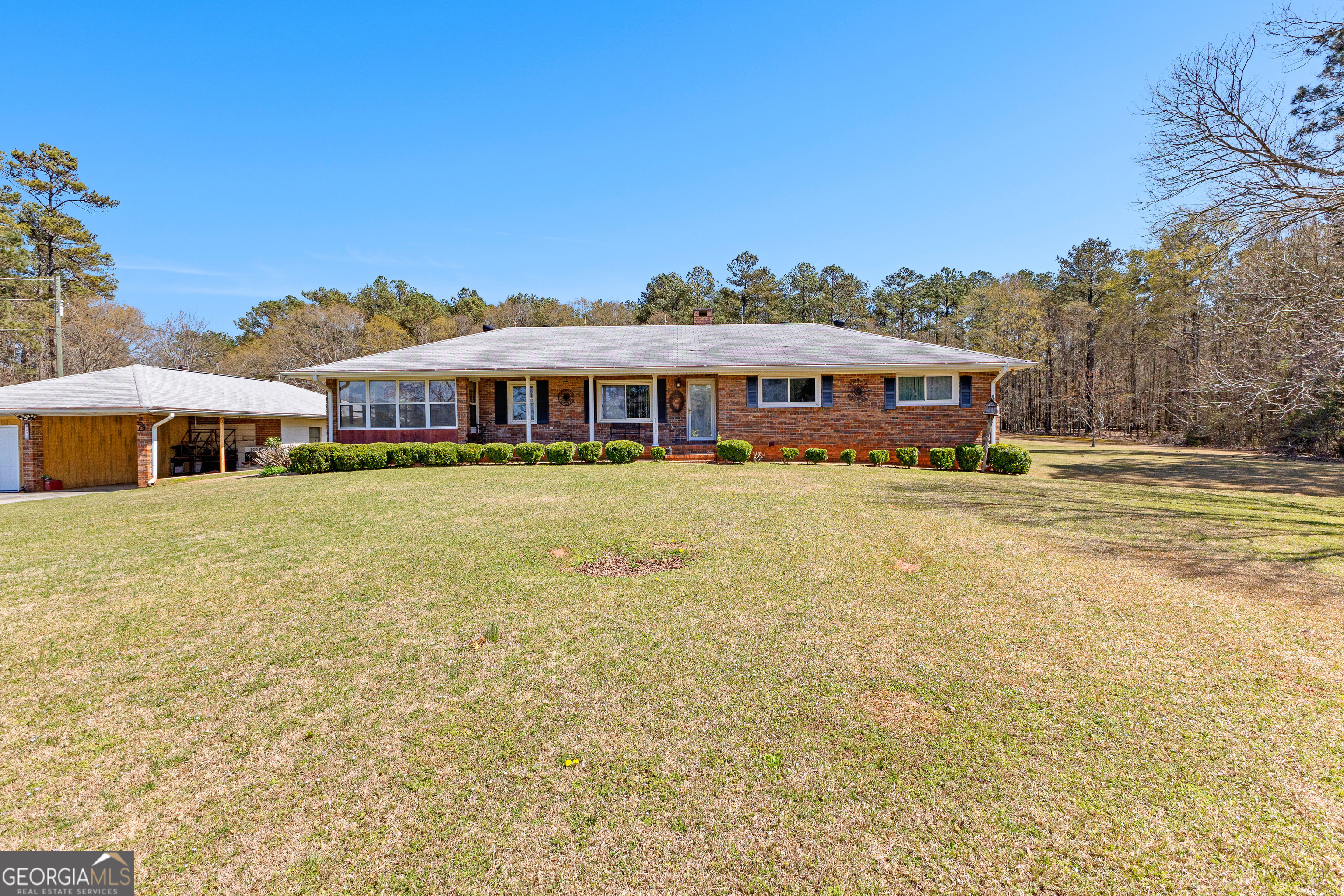 A Rare Opportunity in Highly Desired McDonough! For the first time ever on the market, this generational property presents a once-in-a-lifetime opportunity to own approximately 30.92 acres in one of McDonough's most sought-after locations. This estate offers endless possibilities-whether you dream of expansion, recreation, or simply enjoying the serenity of your own private retreat. The charming home features 2 bedrooms (easily convertible to 3), 2 bathrooms, and a spacious living room with a masonry fireplace-perfect for cozy evenings. The spacious kitchen flows seamlessly into the breakfast area and dining room, making it ideal for gatherings. A bright sunroom offers additional space to relax and enjoy the view. Need storage or workshop space? The full unfinished basement (with both interior and exterior access) provides endless potential, while the detached shop with a carport is perfect for hobbyists or extra parking. The fenced-in backyard adds a touch of privacy and security. Conveniently located near downtown McDonough, Schools, I-75, and Shopping, this property combines country living with city convenience. Whether you envision a private estate, mini farm, or future development, this land is ready to bring your vision to life. Opportunities like this are rare-don't miss your chance to own a piece of McDonough history!