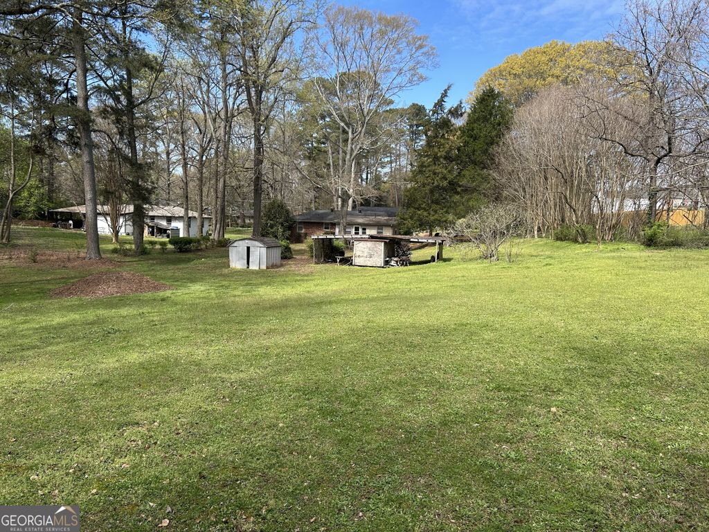 Photo of 4884 Maurice Drive NW, Lilburn, GA 30047 (MLS # 10715367)