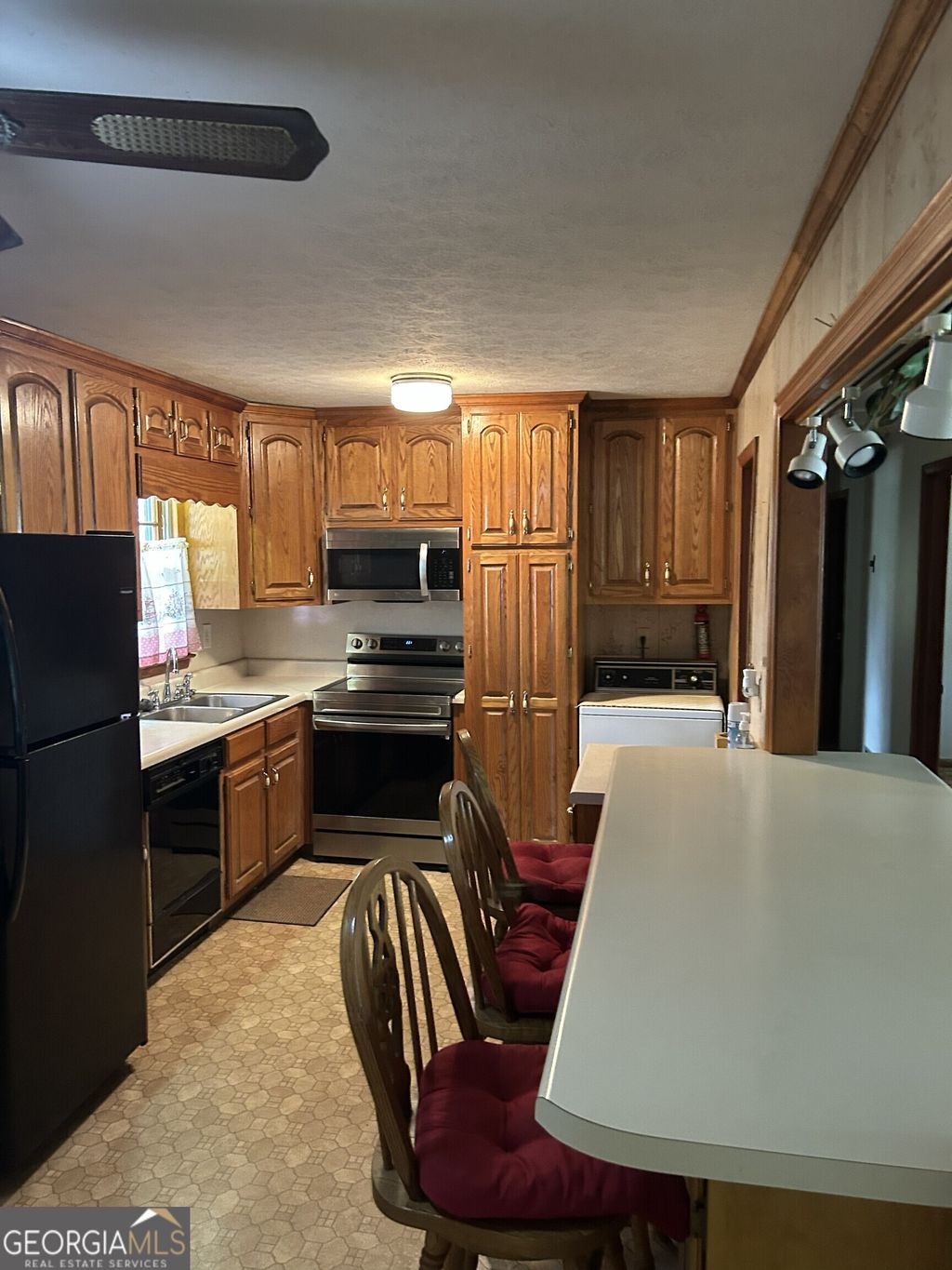 Photo of 4884 Maurice Drive NW, Lilburn, GA 30047 (MLS # 10715367)