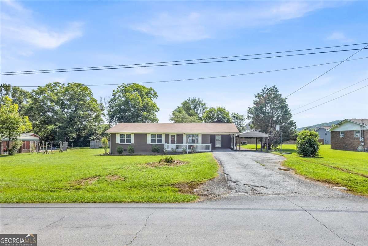 Don't miss this charming brick ranch nestled in the quiet Green Meadow subdivision! This 3-bedroom, 2-bath home features hardwood floors, an updated kitchen and bath, and a spacious screened back porch perfect for relaxing summer evenings. The level 0.46-acre lot offers mature landscaping and includes a large outbuilding - ideal for storage, a workshop, or hobbies. Located just minutes from I-75, Buc-ee's, downtown Calhoun, shopping, schools, and AdventHealth Gordon. Whether you're a first-time buyer, investor, or downsizing, this home offers a great value in a growing area!