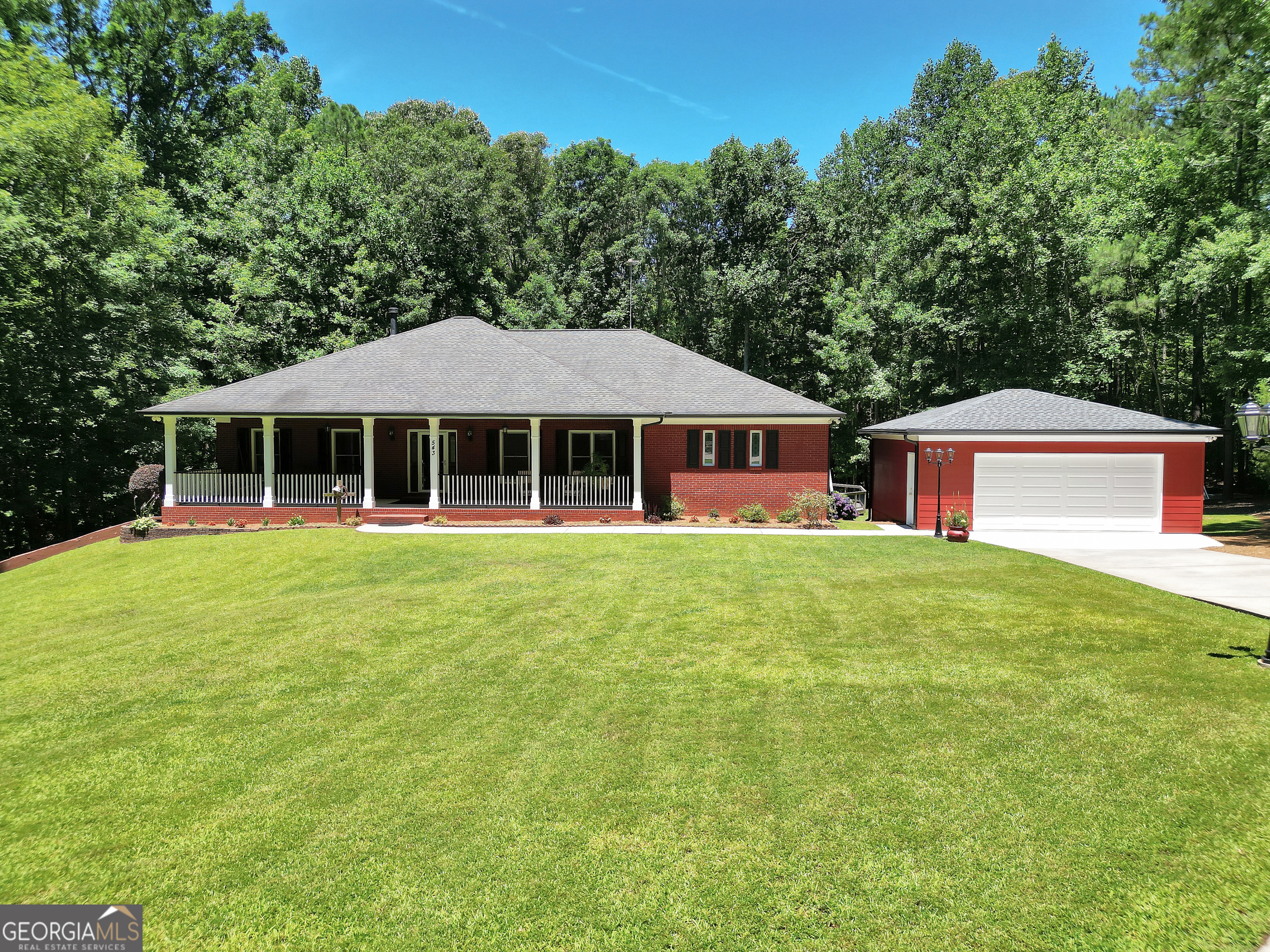Welcome to this stunning custom-built home nestled on an impressive 7.77-acre lot. The home boasts a classic and timeless 4 sided brick exterior with a brand new 2 car detached garage. Step inside to discover a wealth of delightful features, including 5 generously-sized bedrooms and 3 full baths, providing ample space for your family and guests. Recent updates include a new HVAC on the main level, a new pool pump an newer water heater. The beautiful front porch welcomes you into a warm and inviting interior with beautiful hardwood, carpet and tile flooring. The kitchen has been tastefully updated with granite counter-tops, a double oven, new dishwasher and a newer refrigerator. Enjoy summer days by the above-ground pool, hot tub or deck or enjoy the screened in porch. Inside, a wood-burning stove and indoor water feature create a serene and tranquil ambiance throughout the home. The fully finished basement offers endless possibilities with a fully equipped media room, gym, den, full bath and more. Additionally, a storage shed and utility room provide ample space to keep your belongings organized and tidy. Embrace the opportunity to own this exceptional property, offering the perfect blend of serenity, modern conveniences, and abundant space. Don't miss out on the chance to call this splendid property your own.