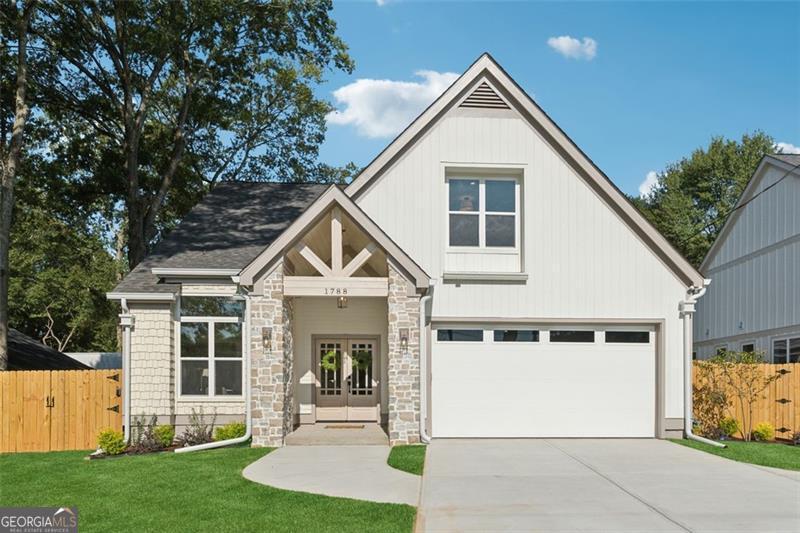 Welcome to Your Dream Home in Marietta, GA! Discover this stunning new construction ranch home on a large lot, ideally situated just minutes from Smyrna Market Village and Marietta Square, The Windy Hill Project, Truist Park, I-75, and Dobbins Air Force Base. The stately double-door entryway welcomes you into a refined foyer, where classic checkered tile floors and a striking custom corbel archway sets the tone for the timeless sophistication that awaits within. This meticulously designed home features 4 bedrooms, 3 full bathrooms, and gorgeous engineered hardwood flooring throughout & accented by custom archways. The heart of the home is the custom kitchen, showcasing wood cabinetry, gorgeous furniture inspired island with turned legs, under-cabinet lighting, a desk area with shelving, striking plaster vent hood, quartz & stone countertops and beautiful scalloped backsplash, pot filler, and full black and brass appliance package including gas range, microwave drawer, dishwasher and refrigerator. The eat-in dining area is perfect for both intimate meals and entertaining. Step into the breathtaking two-story vaulted living room, the wood fireplace surround, arched bookcase shelving with storage and wood beams creates an atmosphere of warmth and elegance. On the main floor, the primary suite is a true retreat, featuring vaulted ceilings, exquisite millwork, a luxurious ensuite with a beautifully marble fluted tile shower with and arched entry. The thoughtfully designed main level also includes two bedrooms and a full bath. The mudroom off the garage has ample storage. Ascend the stairway to another large bedroom with an ensuite featuring a vanity area and arched entry into the shower and double closets, perfect for a teen or in laws! This home is packed with high-end details, including; pre-wired pest control system with Pest Ban, custom millwork throughout, 8-ft privacy fence, stone mailbox, large backyard, electric vehicle charging outlet and an expansive back porch for outdoor relaxation featuring a built-in stone fire pit. Every element of this home has been crafted with luxury and comfort in mind. It also comes with a 2-10 home warranty, providing peace of mind for the future. Don't miss your chance to call this extraordinary property home-schedule your tour today! licensee owned