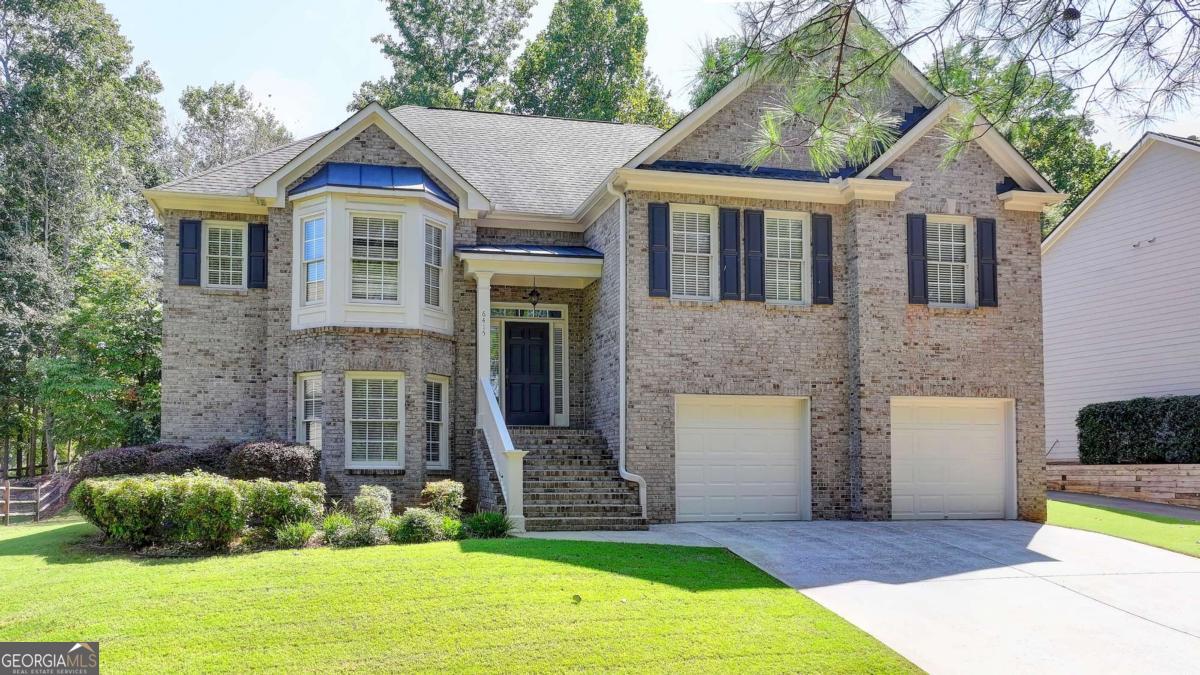 Welcome to Hampton Golf Village! This is your chance to turn a diamond in the rough into your dream home. Situated on the 12th green of Hampton Golf Village, this 5-bedroom, 3-bathroom residence offers an unbeatable opportunity to get into a prestigious community at an accessible price point. Located on a private driveway shared with only six homes, you'll enjoy a sense of seclusion and peace while still being part of the vibrant Hampton lifestyle. The main floor features an open kitchen with a clear view to the great room and a cozy breakfast area-perfect for entertaining. The primary bedroom is a true retreat, complete with a generous sitting area that can easily be transformed into a nursery or a private home office. Downstairs, a spacious recreation room, two additional bedrooms, and a full bath provide plenty of space for family, guests, or a dedicated hobby area. Don't miss this rare chance to build equity and create a home tailored to your exact tastes. Close to shopping, restaurants, Lake Lanier, and the beautiful North Ga Mountains.