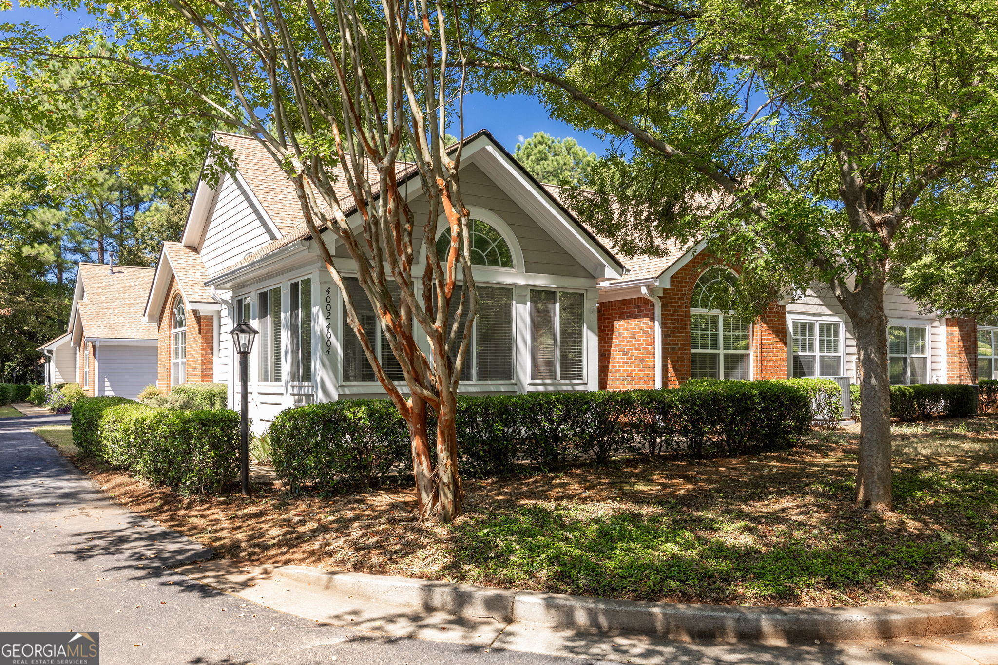 This home was the original model for the complex. It has numerous upgrades, including a larger HVAC system. The current owner, since 2016, has also added new appliances, new LVP flooring, new HVAC (2017). She also had the "popcorn" removed from the ceiling. She has the vents cleaned, put in "handicap" accessible commodes, added closet organizers and a new chandelier. There are also cabinets in the garage! It is an incredibly beautiful home. The refrigerator remains, and the washer and dryer are negotiable. The 3 bedroom 2 bath home with a very bright sunroom is in the newer section of the Vineyards, just before the "guard" house. Beautiful cabinetry in the kitchen, which will also handle a small kitchen table so you don't have to eat each meal in the dining room. The Living/Dining room is expansive. The dining area part will fit a hutch as well as your large table and chairs. The living area is large, with a view of the kitchen. The primary bedroom is ready for your king-sized bed and two end tables as well as a bureau and chest of drawers! There is a huge walk-in closet in the primary bath area. You'll love the separate laundry room with more pantry space for your large items! Delight in the fact that you have no more landscape duties! You will also enjoy all the "get togethers" at the Clubhouse. You can be as active as you want to be and get to know your great neighbors!