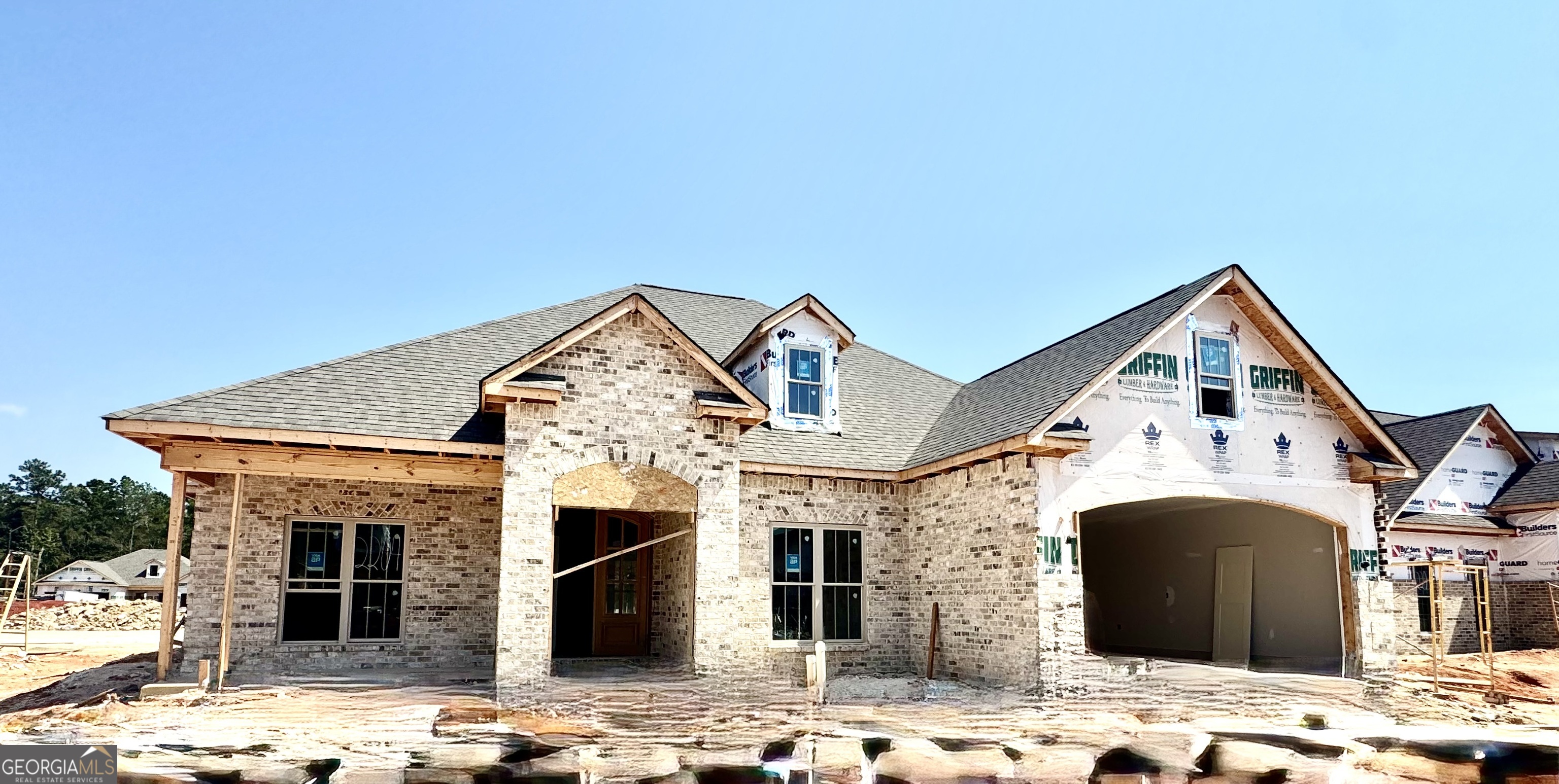 The White Fir Plan is a beautifully crafted 4 bedroom, 2 bath brick home that offers a functional split floor plan with thoughtful upgrades throughout.Step inside to find luxury vinyl plank flooring in the main living areas, with carpet in the bedrooms and tile in the baths and laundry. The living area features coffered ceilings and an electric fireplace with a stunning floor-to-ceiling brick surround, creating a warm and inviting atmosphere. A formal dining area provides the perfect space for entertaining. The spacious owner's suite is designed for comfort and convenience, offering double walk-in closets, a relaxing garden tub, and a fully tiled shower.This home combines elegance and practicality in every detail.