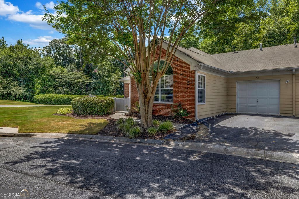 Impeccably maintained garden one level patio home w/ one car attached garage in convenient, close in Stone Mountain location! Hardwood flooring in great room, dining area and hallway. Gorgeous kitchen with breakfast bar, tile mosaic backsplash, gas cooking & refrigerator included! Separate laundry room w/ washer and dryer (they stay!). Spacious primary suite w/ private bathroom w/ large corner shower, huge walk in closet off BR. Close to lots of shopping districts highway 78 and Stone Mountain! Monthly hoa includes sparkling pool, clubhouse and fitness center; trash pickup as well! Move in condition!