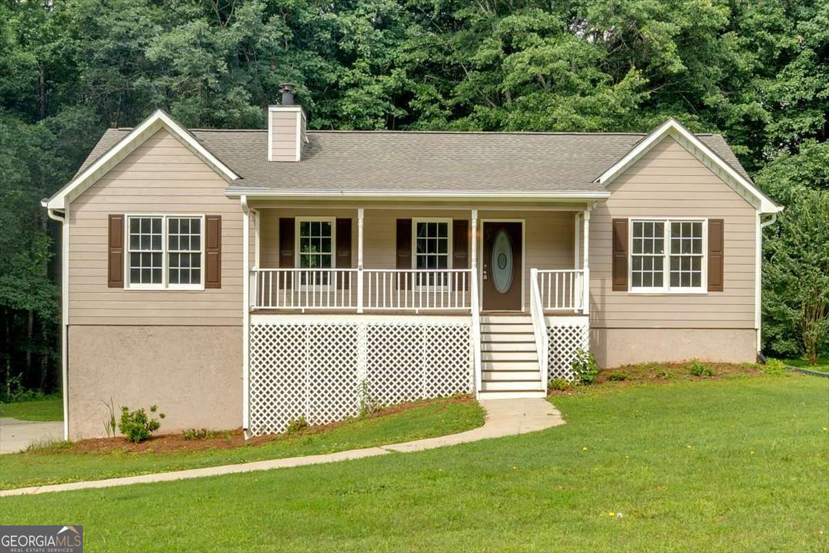 Welcome home!! Located in an established neighborhood on a rare 1-acre lot, this beautifully updated home combines the comfort of community with the privacy of a spacious yard. Every inch of this 3- bedroom, 2-bath home has been thoughtfully renovated, making it truly move-in ready. Step inside to discover all-new flooring, fresh interior paint, and plush new carpet in the bedrooms. The kitchen has been fully modernized with new cabinets, sleek countertops, and stainless steel appliances, offering both style and functionality. Both bathrooms have been completely remodeled, and even the fireplace got a refresh, adding to the home's curb appeal and charm. The partial half-basement provides flexible space for a home office, playroom, gym, or additional storage. Whether you're enjoying coffee on the front porch or back porch, hosting friends in the spacious living room, or planning big backyard projects, this home has the upgrades, space, and style to make it all possible. Schedule your showing today and see why "The Remodel Rocket" is ready for launch - and ready to welcome you home.