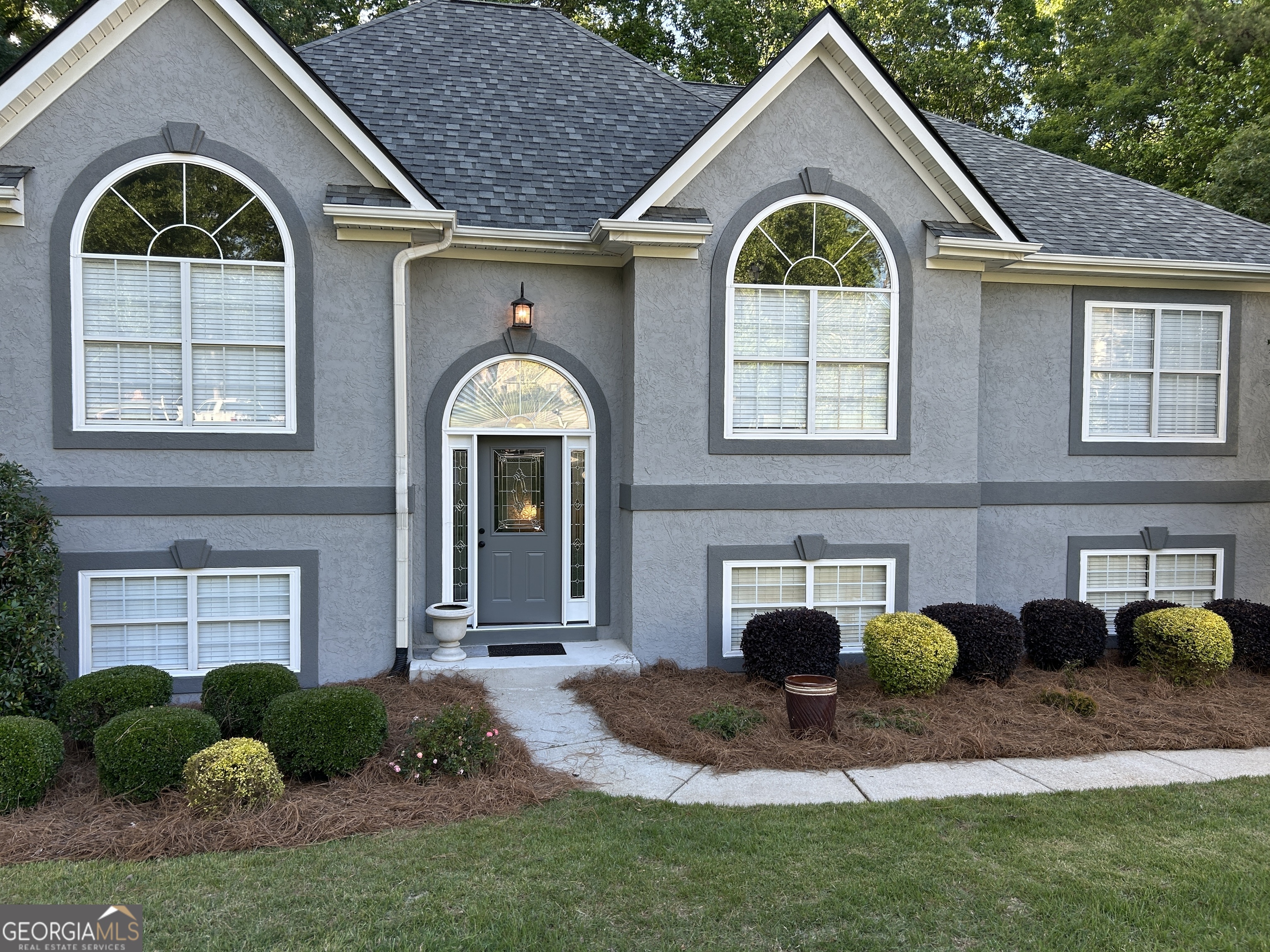 Freshly updated, thoughtfully designed, and ready for its next chapter! Welcome to this spacious 6-bedroom, 3-bathroom home tucked into a quiet, established neighborhood in sought-after Henry County. With a fresh exterior, a newer roof, and a brand-new water heater, this home is move-in ready for your biggest plans and brightest dreams. Step inside and discover a flexible split-level layout offering room to live, work, create, and gather. The main floor flows easily with generous living spaces, a bright kitchen, and large bedrooms filled with natural light. Downstairs, the fully finished lower level-with its own private entrance-opens the door to endless possibilities: a guest retreat, hobby zone, home office hub, or anything you need to grow into your next season. Sitting on approximately one acre with a sloped, private lot, there's plenty of outdoor space to enjoy quiet mornings, weekend projects, or evening get-togethers. The setting offers the perfect balance of privacy, possibility, and connection to the community around you. Located in the highly regarded Ola school district and convenient to dining, shopping, and parks, this home blends everyday comfort with room to dream big. Modern updates, flexible space, and a setting that feels like home - and it's almost ready for you. More photos and full interior details coming soon!