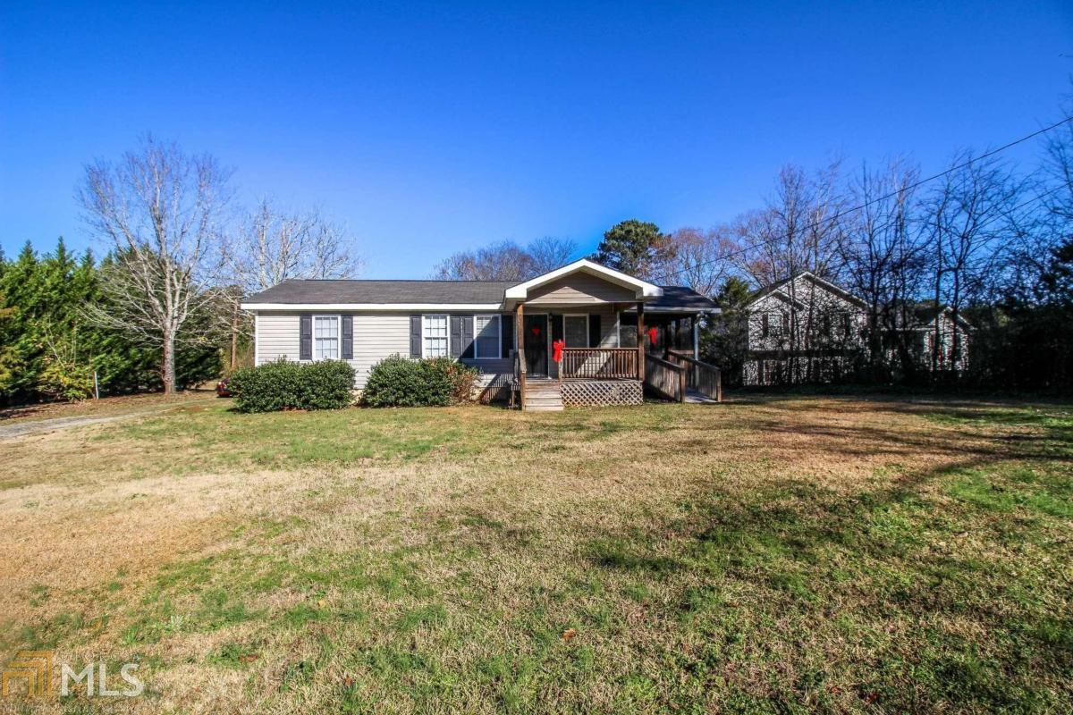 Adorable home in convenient location. Walk in the side door to the large den that includes a separate laundry room. Kitchen includes wood cabinets, stainless appliances, separate eating area and a door that leads out to a beautiful screened porch with stained pine ceilings. This stunning porch will be a great place to relax, unwind and take it easy. There are two bedrooms and a front room that that has a full bath right off of it that could be used as a bedroom. Outside you will find a large level lot with a substantial size outbuilding.