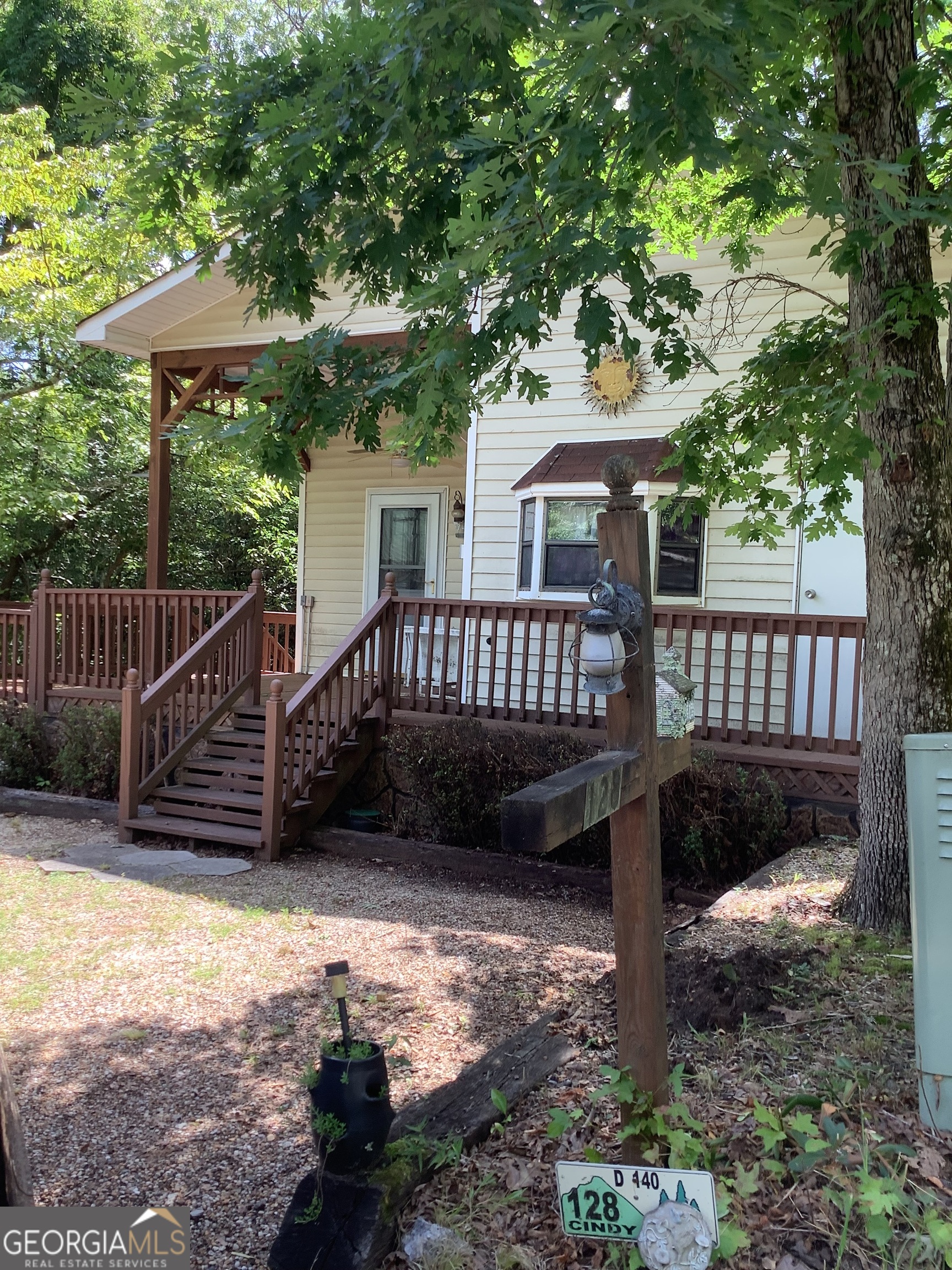 THIS IS 2 BEDROOMS & 1 & 1/2 BATHS, A PARKMODEL WITH ROOM ADDITION WITH COMPLETE ROOFOVER . LOTS OF ROOM, LARGE OPEN LIVING ROOM DINING ROOM AND FULL SIZE KITCHEN, COVERED FRONT PORCH, JUST A SHORT WALK TO THE LAKE IN THIS GATED MOUNTAIN COMMUNITY WITH LOTS OF AMENITIES TO ENJOY SUCH AS A 52 ACRE LAKE, CHAPEL, DINER, CLUBHOUSE, 2 OUTDOOR POOL, 1 INDOOR POOL, STABLES, PUTT PUTT COURSE, WALKING TRAILS AND MORE. CLOSE TO HELEN, CLEVELAND, DAHLONEGA, GAINESVILLE