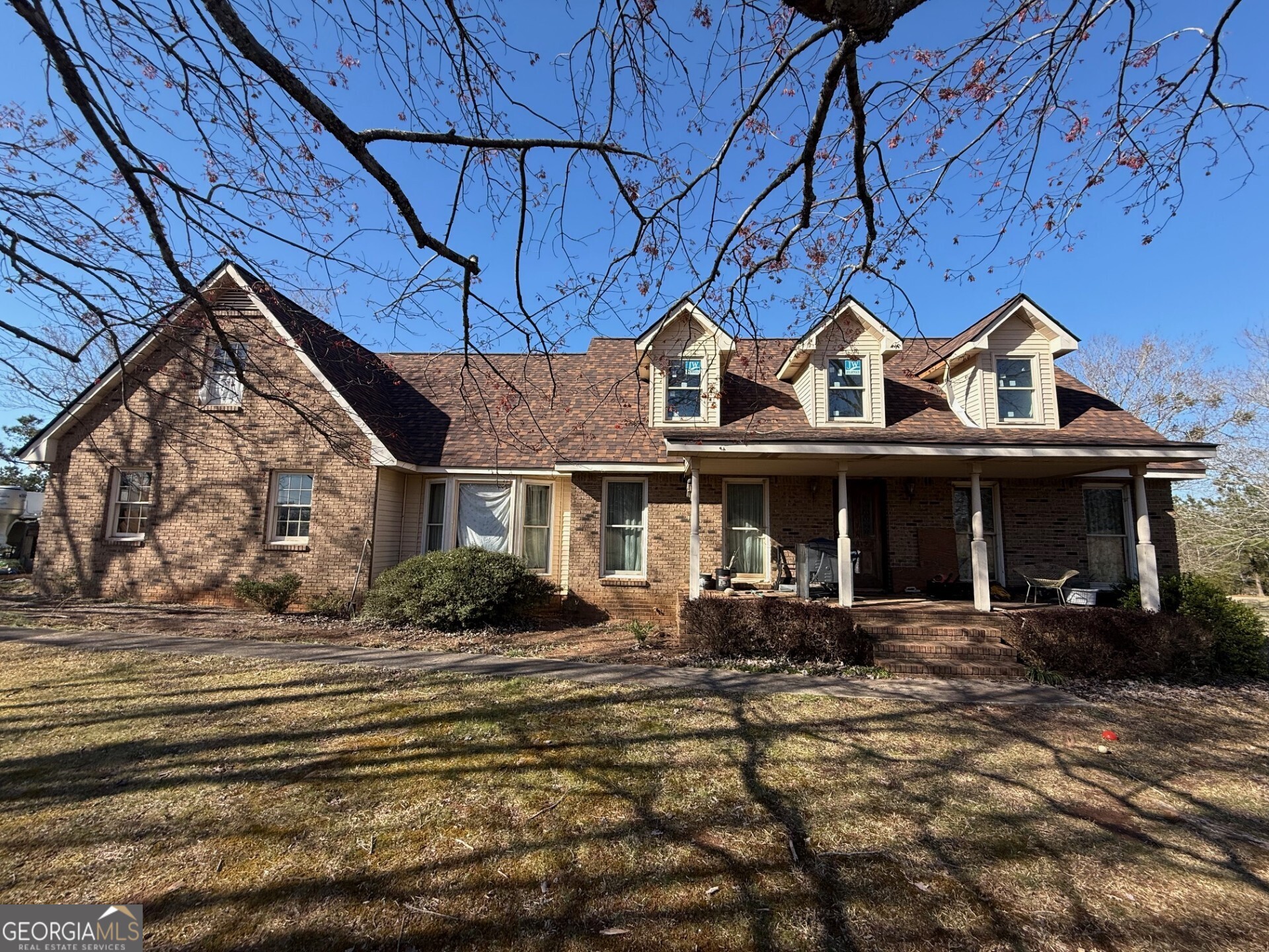 Exceptional opportunity to transform a well built brick home nestled on a five acre lot in sought after Brooks. Enjoy glorious sunsets from your front or back porch, raise chickens and plant a garden, create your own country oasis. The homestead you've been dreaming of awaits. The home features a huge primary bedroom on the main level, a spacious family room, separate dining room and kitchen. Upstairs you will find two bedrooms with a Jack & Jill bath plus a partially finished bonus room. The unfinished basement is the perfect place to tinker. The home is conveniently located near Senoia, Peachtree City, Piedmont Hospital, and the Hartsfield International Airport.