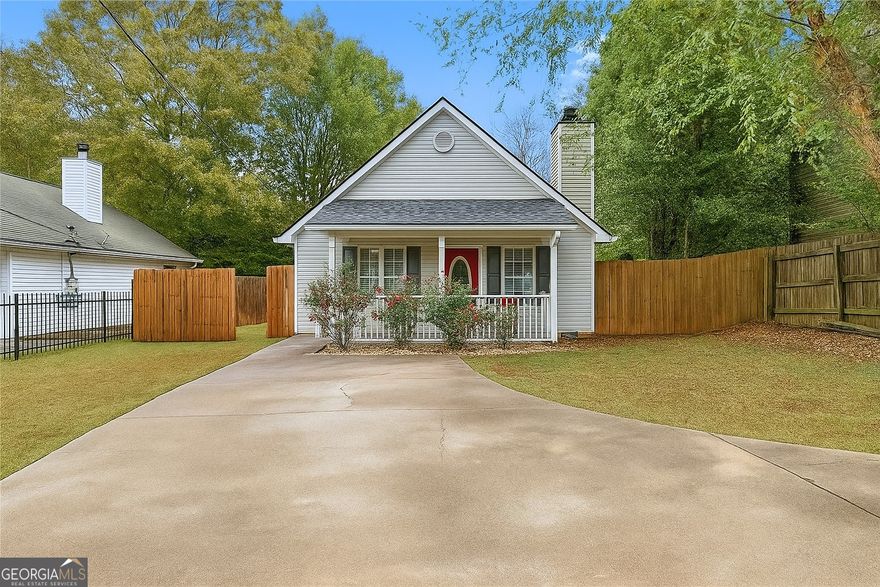 Nestled just minutes from Lake Lanier, this welcoming cottage is move-in ready and designed with comfort in mind. Recent updates include a new roof with gutter guards (2020), a new washing machine (2025), a new hot water heater (2025), and a new fridge with icemaker and water (2024). The kitchen has been updated with slide-out drawers in the pantry, and the master bath features a new walk-in shower, vanity, smart mirror, and ample storage and drawers in the master vanity. The septic tank was just serviced, ensuring peace of mind for years to come.The low-maintenance vinyl siding, along with three-sided privacy fencing, provides ease and privacy, while the tiled and laminate floors add durability and charm. Ideally situated near GA Hwy 400, you'll find convenient access to shopping, dining, schools, and a variety of recreational options. Tidwell Park is nearby, offering dual boat ramps, fishing, swimming, and picnicking, and the new Cumming Aquatic Center, Cumming City Center, and University of North Georgia is only a few minutes away. With low Forsyth County taxes and excellent schools, this home combines affordability with a high quality of life.