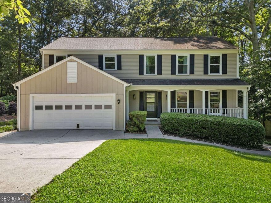 Don't miss this rare opportunity in East Cobb's sought-after Heritage Glen! This move-in ready 4-bedroom, 2.5-bath home combines timeless curb appeal with the modern updates today's buyers are looking for-but it won't last long. With nearly new interior paint and gleaming hardwood floors throughout the main level, the home welcomes you with light-filled living spaces and a flexible floor plan perfect for both daily living and entertaining. The cozy fireside living room flows seamlessly into the updated kitchen, featuring granite countertops, stainless steel appliances, and crisp white cabinetry. The dining area offers just the right amount of separation while maintaining an open feel as it connects to the kitchen and the versatile bonus/flex room. Upstairs, the oversized primary suite includes a walk-in closet and a beautifully updated private bath with a freestanding soaking tub. All secondary bedrooms are generously sized. Enjoy additional living space in the screened-in deck overlooking the wooded backyard-perfect for morning coffee or evening relaxing. The fully fenced, level backyard also includes a patio ideal for grilling and play. Recent upgrades include new windows, HVAC, updated lighting, and thoughtful cosmetic improvements throughout. Located in a well-established community with top-rated schools, no HOA, and easy access to parks, shopping, and dining, this home offers unbeatable value in East Cobb. Schedule your showing today-this one will go fast!