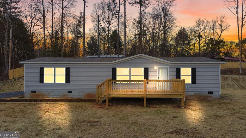 Move-in ready in Ellijay! This nearly new 3BR/2BA manufactured home on a permanent foundation offers 1,568 sq ft on a spacious 1.85-acre lot with inviting front and back porches. Enjoy true ease of ownership-new HVAC, roof, water heater, landscaping, and driveway-plus high-speed internet, power in place, well and septic in place, telephone available, strong cell service, no HOA, and you're under 10 minutes to downtown Ellijay for dining and entertainment. Whether you need a full-time residence, mountain getaway, or investment, this property checks the boxes. With the permanent foundation, the home is considered real property and qualifies for FHA, VA, and Conventional financing. Don't miss this one-come see it today!