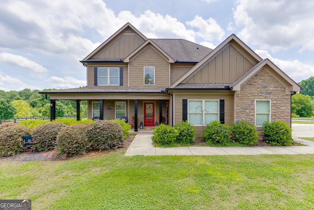 Welcome to this beautiful Craftsman-style home in the highly sought-after Finch Landing subdivision! Built in 2019, this charming two-story residence sits on a generously sized 0.75-acre wooded lot, offering privacy and serenity with a rocking chair front porch perfect for relaxing evenings. Inside, you'll find an open-concept floor plan featuring rich hardwood flooring, a wood-burning fireplace, and a spacious separate dining room ideal for entertaining. The heart of the home is the kitchen, boasting custom-built cabinetry, granite countertops, and modern finishes throughout. Upstairs, the large owner's suite provides a peaceful retreat with a luxurious bathroom that includes a garden tub, separate shower, and granite vanity countertops. Additional highlights include upgraded wall-to-wall carpet, quality craftsmanship, and attention to detail in every room. This home qualifies for 100% USDA financing.