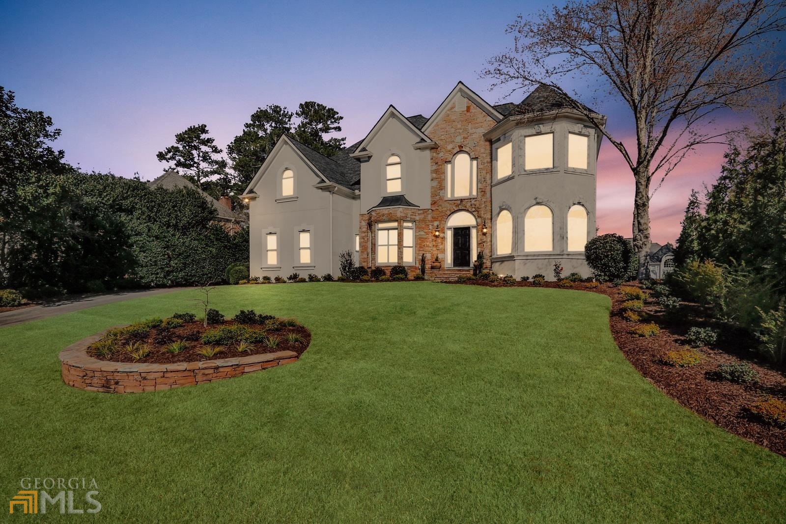 Totally renovated beauty with stone and hardcoat stucco in the sought after neighborhood of the Falls of Autry Mill.