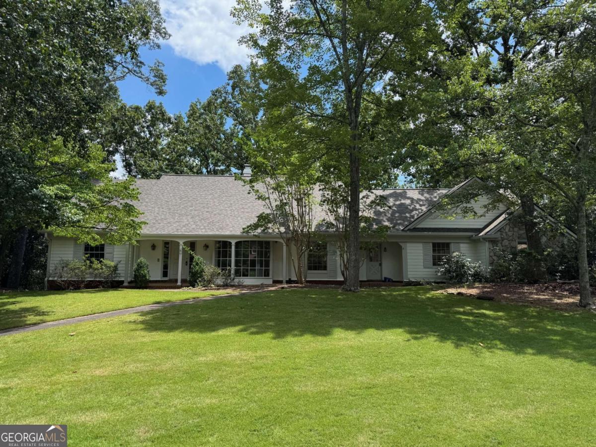 Rare traditional home on premier lot in Rivermont Golf Club Community. Amazing opportunity in the prime part neighborhood to expand living areas with a full daylight basement and unfinished space above the garage. Oversized corner lot on cut-de-sac with a great front porch overlooking lushly landscaped community. Updates include renovated baths, newly painted exterior, new carpet, newer roof. Opportunity to update floorplan by opening the mud room and family room to kitchen and reconfiguring kitchen space. The back of the home features a large deck with private wooded views. Optional membership in Rivermont Golf Club and discounted social memberships available to Rivermont homeowners. The community has a private 27-acre, riverfront park with playground, hiking trails and amphitheater for concerts. You will love how close to shopping and dining and GA-400. This is a great home in a desirable community.