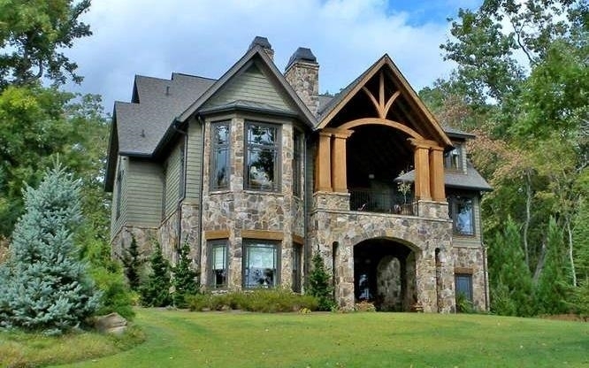 Exquisite Craftsman-style home on Lake Chatuge! Prestigious address in most-sought after location on the lake. Private, yet only minutes to town. Most home furnishings and decor are included in sale. Meticulously maintained. Elevator, newer roof, new whole-house generator, surge protection, HVAC humidification and filtration, water purification and softening systems, camera security system, home theater, library, and billiards room. Main Level and Lower Level kitchens have Wolf, Subzero and Asko appliances. Outdoor fireplace to enjoy chilly evenings by the lake. Very gentle slope to water. Deep-water, double-slip covered dock with electric & water, 2 lifts and kayak ports.