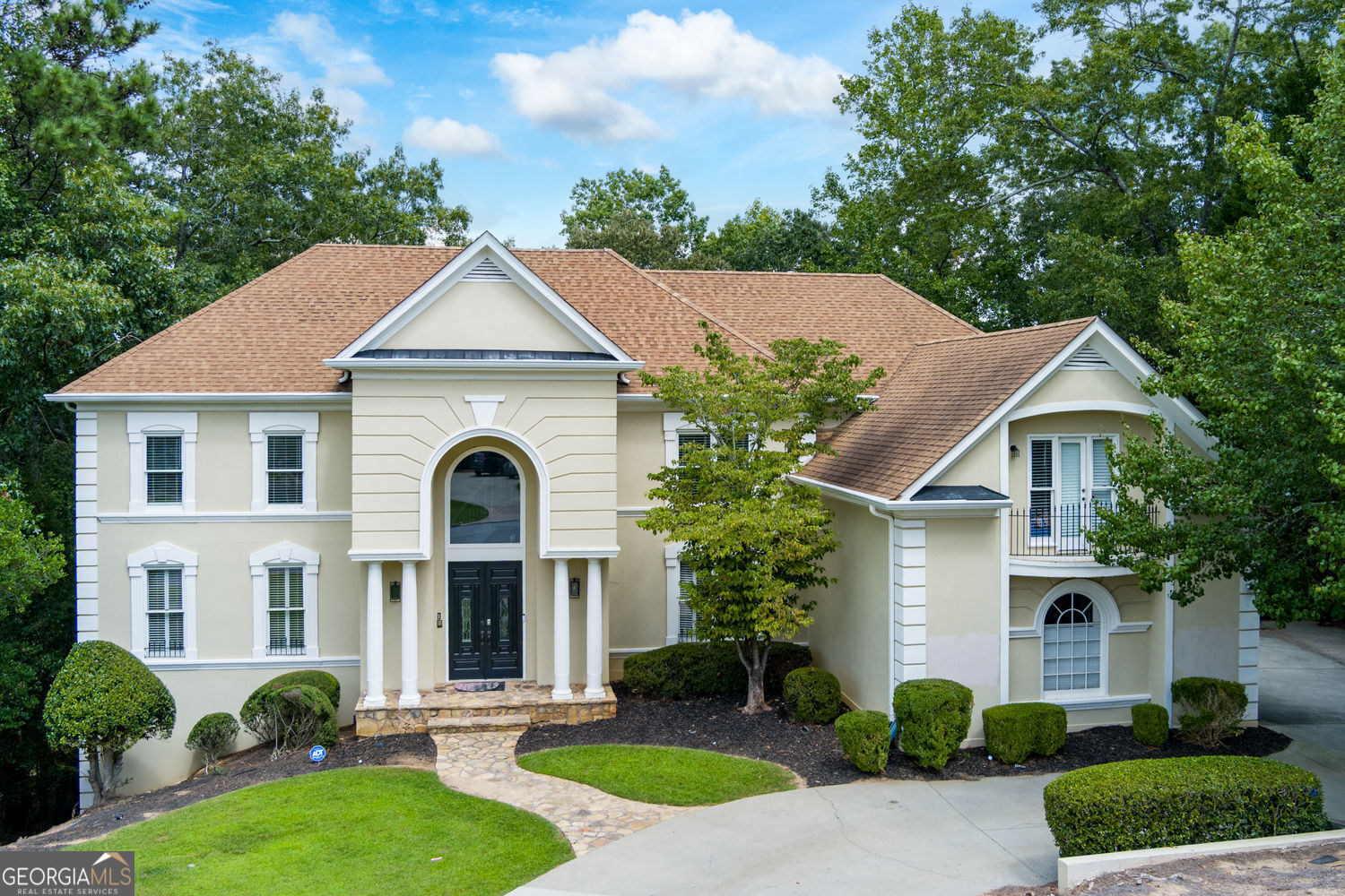 Wonderfully renovated estate home featuring a two story marble foyer with coat closet. Winding staircase with iron balusters opens to the vaulted great room with wall of windows, gas fireplace and built-in cabinets, bookshelves, bar with sink, cabinets and wine rack. Separate spacious living room. Half bathroom. Huge chef's kitchen makes entertaining a breeze with it's wine refrigerator, granite countertops, abundant cabinetry, stainless steel dishwasher, refrigerator, breakfast bar and built-in desk. The open dining room and living room help the entertainment flow without missing a beat. Don't miss the window seat that overlooks the spacious multi-level deck. Gorgeous primary bedroom retreat with fireplace, coffered, lighted ceiling, hardwood flooring updated lighting and access to the deck. Spa primary bathroom features a clay foot bathtub, double vanities with abundant countertop space, cabinetry, glass tile shower, tile and stone surround and marble flooring. Spacious secondary bedrooms and updated full bathrooms with no detail left unturned. Vaulted bonus room with several closets. Completely finished terrace level with wine room, two large bedrooms and spacious spa bathroom with tile shower, separate soaking tub, tile flooring and wall surrounds. Workout room with ceiling fan and luxury plank flooring. Full bathroom with tile shower. Full kitchen in basement with gas stove, vent hood and stainless-steel refrigerator. Full bar and theatre ready to enjoy! Exit onto the covered deck with ceiling fan. Sentinel on the River features a community pool and tennis courts. Walk to the Chattahoochee River from your home. Wonderful schools and conveniently located to shopping, restaurants, golf courses and healthcare facilities.