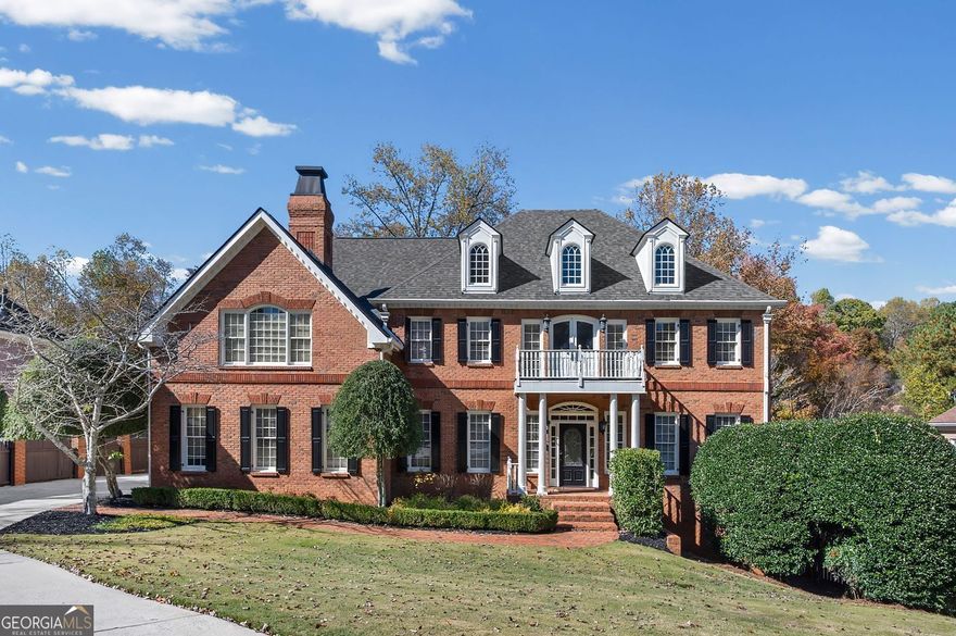 Nestled in the heart of East Cobb's top Walton High School district, this welcoming residence presents an amazing design crafted with quality details and is offered in wonderful condition. Current owners have invested over $140K in improvements to the property.  This inviting home welcomes all as you step into the open two story foyer and behold a lovely curved stairway that leads to the upper level.  The home stands as a testament to sophisticated design with tray and coffered ceilings, as well as crown molding that accentuate the space with superior craftsmanship, creating an atmosphere of refined elegance, while built-in shelves and hidden pocket doors offer both functionality and aesthetic appeal. The dual-sided fireplaces are a focal point, promising warmth and ambiance, complemented by the soaring high vaulted ceilings that enhance the room's spacious feel. In the kitchen, culinary dreams come to life amidst a spacious kitchen with granite counters, providing ample space for both preparation and gathering. The kitchen peninsula bar offers additional seating and serving options; in addition, the backsplash and crown molding add a touch of sophistication. The property boasts five bedrooms, four full bathrooms, as well as 2 powder rooms, offering plenty of private space.  The oversized primary suite is truly exceptional with a dual-sided fireplace that connects the primary bedroom to a cozy sitting area amidst built-ins and a private wet bar; then enter the primary bath/spa area to a large walk-in closet with custom shelving + a second walk-in closet for storage; the light filled primary bathroom/spa offers his & her vanities, a soaking tub, separate tiled shower, linen closet and private water closet.  The upper level offers a split bedroom design on the opposite wing of the house, where 3 additional secondary bedrooms are, including a guest bedroom with built-ins and a private ensuite bathroom; the 3rd and 4th bedrooms share a spacious Jack & Jill style bathroom with dual vanities. The expansive terrace level features a large recreational area, a 5th bedroom / bonus room, a full bathroom and lots of space for storage.   French doors lead out to the large multi-tiered deck that extend the living space outdoors, providing areas for relaxation and enjoyment of the private wooded backyard. This beautiful brick home offers an unparalleled living experience, blending amazing design with quality accents to create a truly exceptional home. The Waterford Green subdivision is conveniently located near the Gold Branch Trail, Willeo Park, Azalea Park, Chattahoochee Nature Center as well as shopping (the Avenues of East Cobb) and restaurants (near Historic Roswell area).