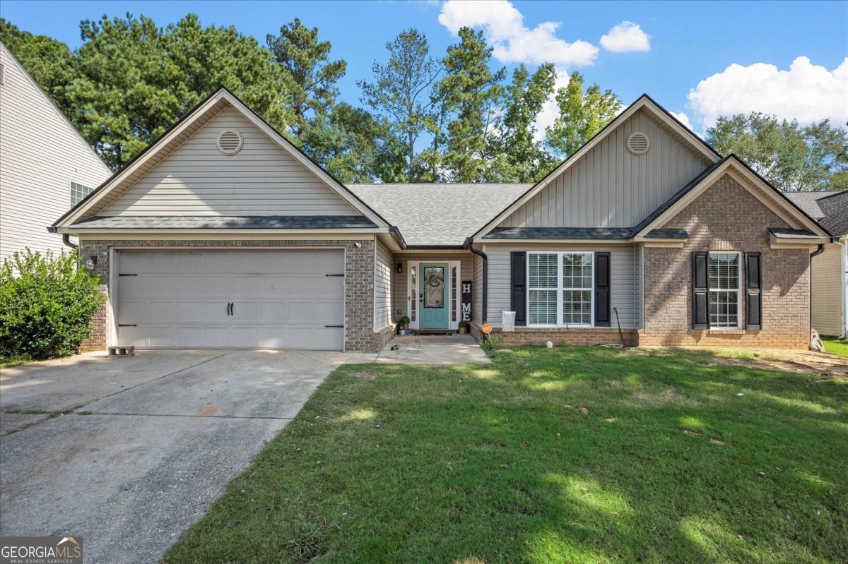 Brick-front ranch with a great location! The house has been priced to reflect the need for new carpet in the four bedrooms and for some light touchup paint throughout the house. This is a great opportunity for a move-in ready home that can be lightly customized to your liking. Spacious one-level living, 2-car garage, and a level yard. Inside, a vaulted great room flows to a farmhouse-inspired dining room and a sunny breakfast nook. The eat-in kitchen features painted cabinets, hex-tile backsplash, newer stainless appliances, and a pantry. A spacious owner's suite with tray ceiling and double vanities is the perfect place to relax. Laundry and secondary bath have been updated. New LVP floors through the main living areas. Out back, a patio overlooks the large yard full of potential.