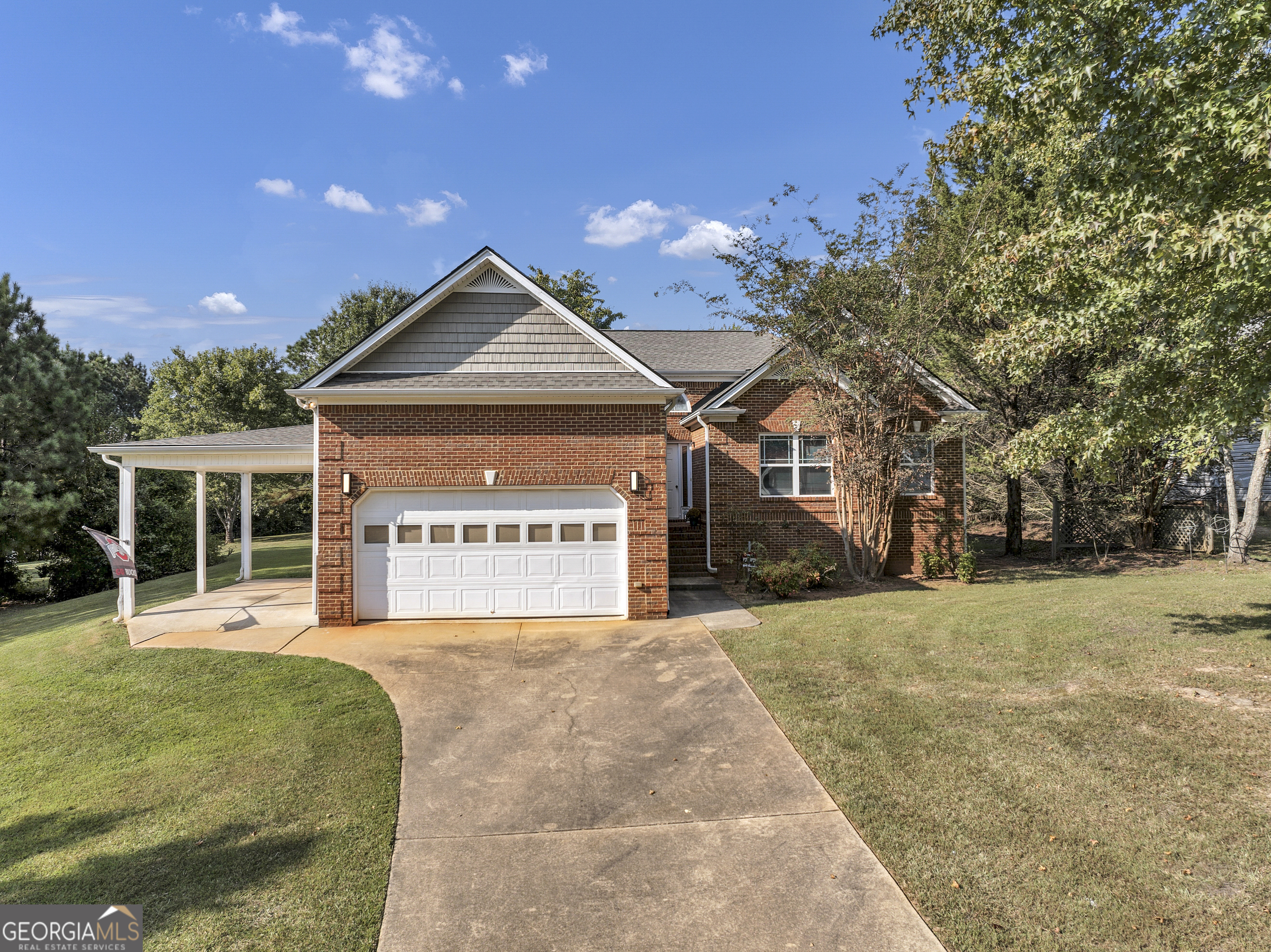 Priced way below fair market value for a quick sale, this home gives you the chance to enjoy instant equity while moving into a beautifully updated property. Welcome to this oversized 3-bedroom, 2.5-bath brick home situated on 1.5 acres. This move-in ready property offers a perfect mix of comfort, functionality, and outdoor living. The interior features fresh paint throughout, providing a clean and inviting atmosphere. A spacious floor plan offers soaring ceilings with an oversized living area designed for both everyday living and entertaining. The open and airy farmhouse style kitchen with corian counters tops, and dining room area flow seamlessly, while large windows bring in plenty of natural light. The spacious owners suite features a large walk in closet, private bath with a double vanities, separate shower, and a soaking tub perfect for relaxing after a long day. Outside, enjoy the brand-new deck overlooking the large backyard, perfect for peaceful early morning beverage, entertaining guests or family gatherings. The property is fully equipped with a new backyard fence, a new roof, a detached 5-car garage with a flex workshop area and a storage shed perfect for tools and equipment. Set back on a generous lot, this home offers the space and privacy you've been looking for-all while remaining convenient to nearby amenities. With its recent updates and move-in ready condition, this property is ready to welcome its new owners. Largest lot in the community. Located in highly sought after USDA-zero money down community. Minutes from popular eateries, shopping centers and Carrollton Greenbelt. OPEN HOUSE DAILY. Call for times.