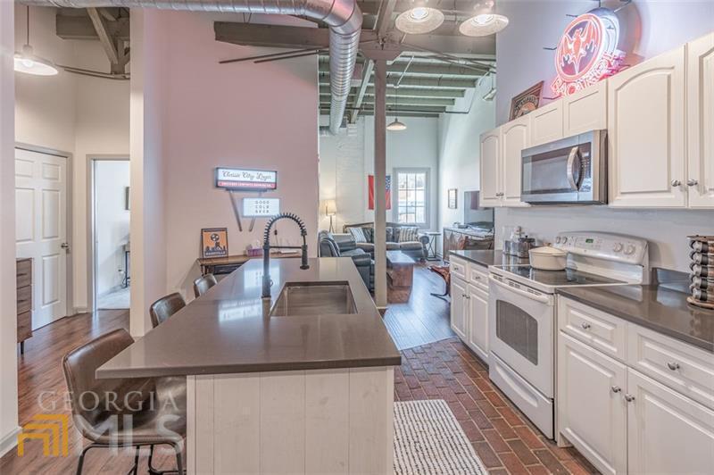 Awesome location in downtown Athens on top of 5 Bar and across the street from Last Resort Restaurant. This Cotton Exchange 2 bedroom loft is an AWESOME location! Only a block away from campus and in the middle of downtown Athens, you can walk to restaurants, bars and shopping. This 2 bedroom, 1 full bath loft style condo has updated granite countertops, new carpet in bedrooms, luxury vinyl flooring in family room, new paint, new hvac, new bathroom vanity and new bathroom flooring. Secured building, 1 car parking spot in covered garage. additional paid parking a block away. Move in ready!