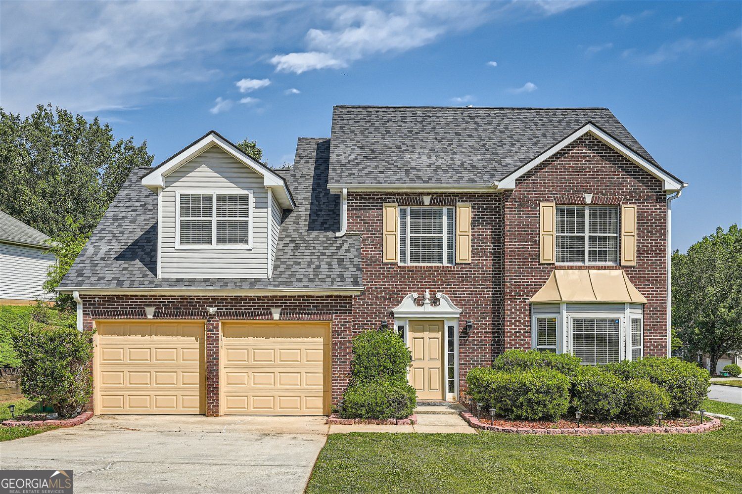 Welcome to this stunning two-story residence that exudes charm and sophistication! As you approach the home, you are greeted by its eye-catching exterior, featuring a combination of attractive brick and vinyl siding, accented by a well-maintained lawn and appealing landscaping. The inviting double garage door provides convenient access, while the front porch, framed with tasteful decorative elements, welcomes you into a world of comfort and style. Step inside to a spacious and airy foyer that sets the tone for the rest of the home. Upon entering, you are immediately impressed by the open layout, showcasing beautiful flooring that flows seamlessly throughout. The interior boasts fresh, neutral tones that provide a perfect backdrop for any decor style. To the left of the entryway, a cozy living room beckons, featuring large windows that bathe the space in natural light, which enhances its warmth and openness. The adjoining dining area exudes elegance, with a stylish table that stands ready for family gatherings and intimate dinners alike. The heart of the home is undoubtedly the modern kitchen, equipped with sleek cabinetry, generous counter space, and an array of stainless steel appliances, ensuring both functionality and style for culinary enthusiasts. It's designed for both everyday meals and entertaining, offering a delightful view of the adjoining breakfast nook, which opens to a charming outdoor patio. Perfect for al fresco dining, this outdoor space is surrounded by greenery and ideal for summer gatherings or morning coffee. Continue your tour to discover the inviting family room, where comfort meets functionality. This space is an excellent choice for relaxation or hosting friends, featuring plush seating and a cozy fireplace that adds a touch of warmth and charm on cooler evenings. Just a few steps away, a thoughtfully designed powder room and a spacious laundry area add to the practicality of the main level. Venture upstairs to a restful retreat that houses multiple bedrooms, each with its unique character and generous closet space. The master suite is a true sanctuary, featuring a beautifully appointed bedroom, an exquisite walk-in closet, and a private bathroom that boasts dual sinks, a luxurious shower, and elegant finishes. Additional bedrooms offer ample space for family or guests, while the second floor also includes a well-designed full bathroom that serves the other rooms conveniently. The backyard is an inviting oasis, featuring a well-manicured lawn and sitting area, perfect for outdoor gatherings or simply enjoying a peaceful moment in nature. The property is ready for backyard barbecues, gardening, and endless outdoor enjoyment. This residence seamlessly balances style, comfort, and practicality, offering every feature a modern family could desire. Don't miss the opportunity to make this beautiful home your own!