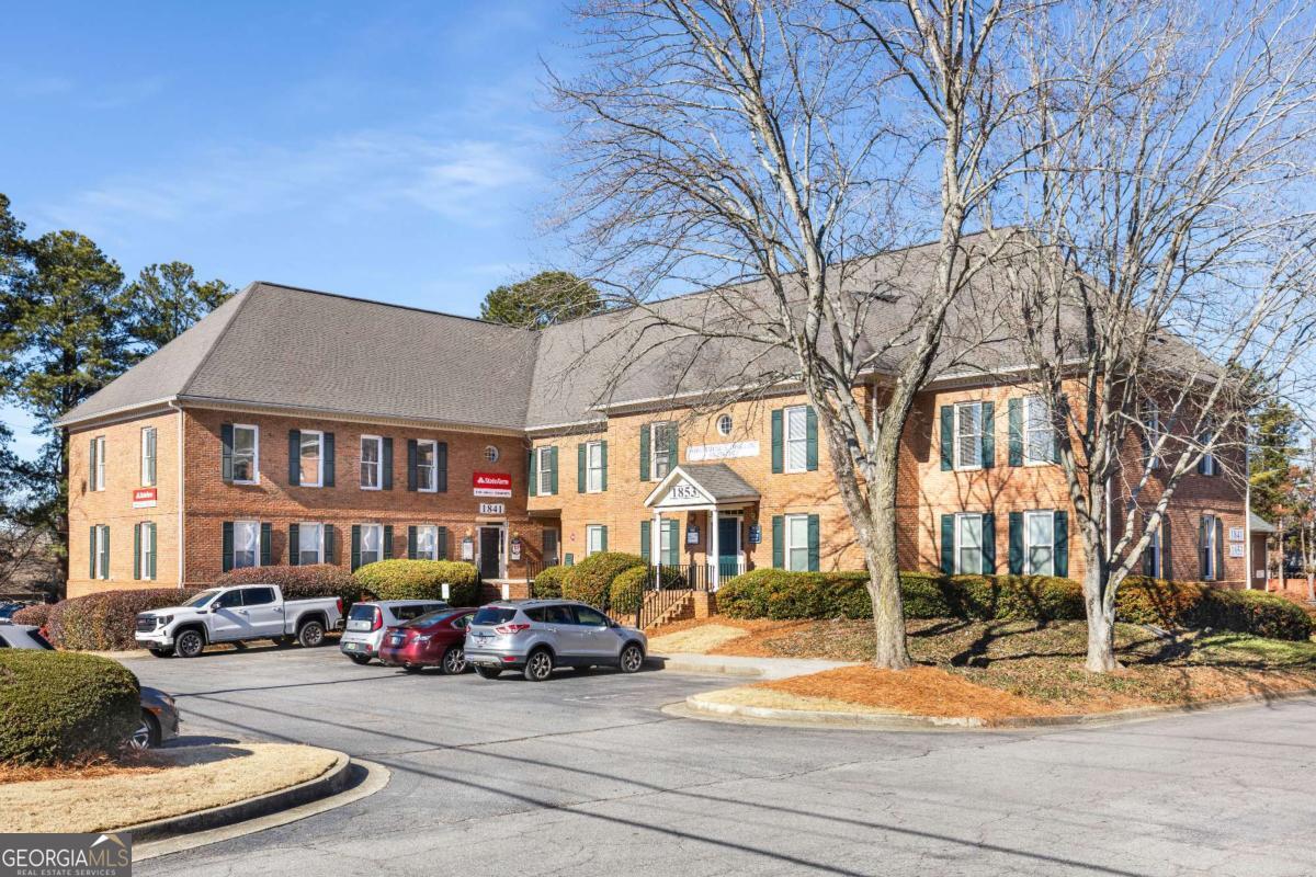 Flexible move-in ready office space with easy access to major highways, great parking, private entrance, multiple offices, kitchenette, and in-suite bathroom in a great location across from Sprayberry High School! This second floor suite has a reception area and 5 offices, one being used currently as a conference room. It's a perfect set up for any professional such as a tech company, marketing firm, counselors, attorneys, medical practices, boutique real estate firms, and more. Office furniture could be negotiated as part of the sale for an additional fee! All in a prime location next to other retail convenient for you and your target demographic. Check it out today!