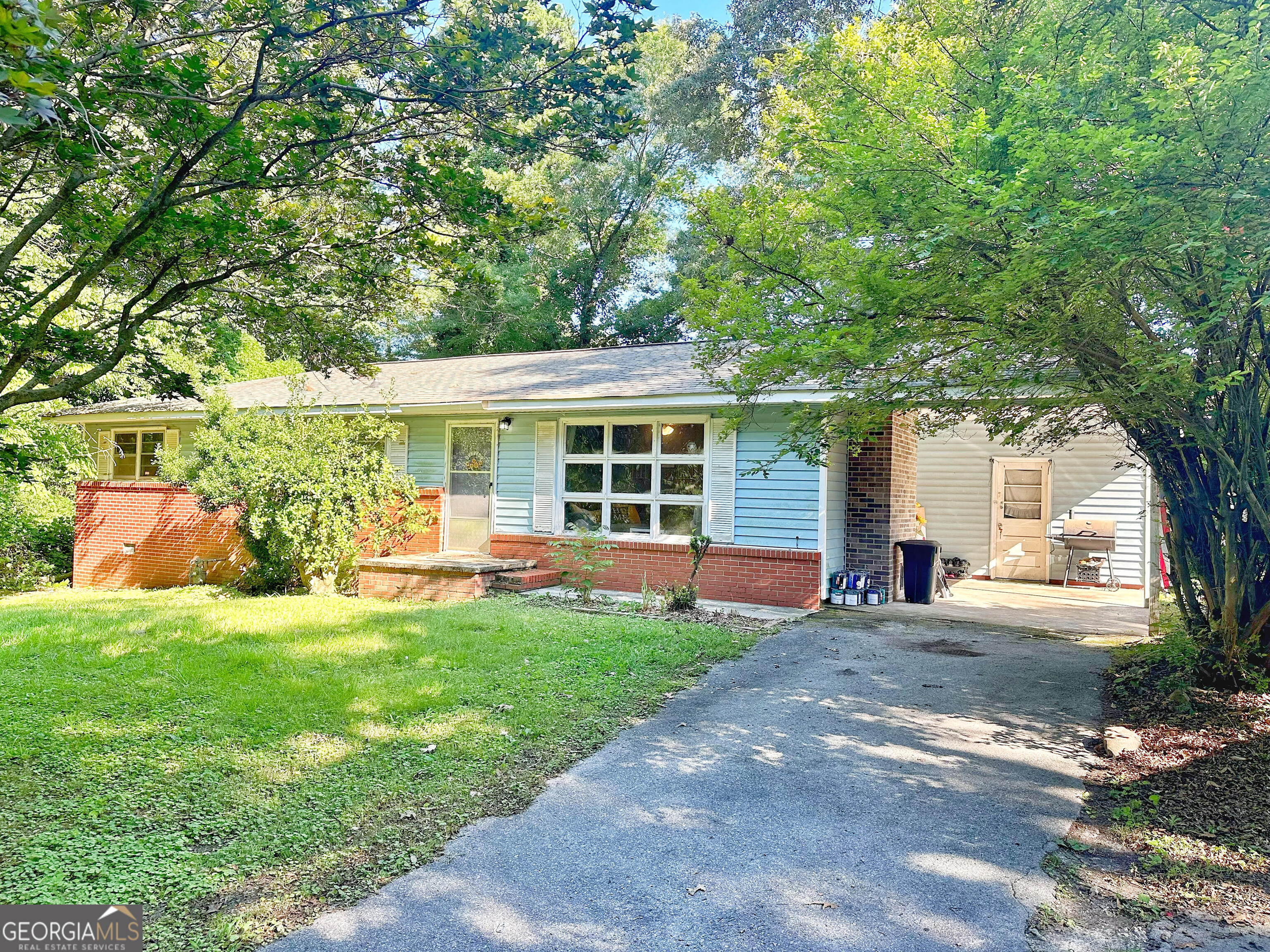 This 3-bedroom, 2-bath home is a wonderful opportunity for anyone looking for a place to make their own. Inside, you'll find an updated kitchen with plenty of cabinet space and appliances included. The living area is bright and inviting, filled with lots of natural light and centered around a charming brick fireplace. The fenced-in backyard is ideal for kids and pets, and the attached 1-car carport provides covered parking with extra storage. Located right next to Trion City Schools, this home is perfect for families who want to stay close to schools, shopping, restaurants, and local conveniences. Sitting on a generous lot with beautiful mature magnolia trees, it offers a sense of privacy while still keeping you connected to everything you need. Don't miss out-schedule your showing today!