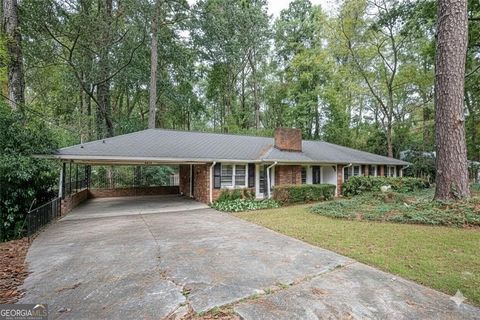 Photo of 5860 Greenbrier Road NE, Atlanta, GA 30328 (MLS # 10640669)