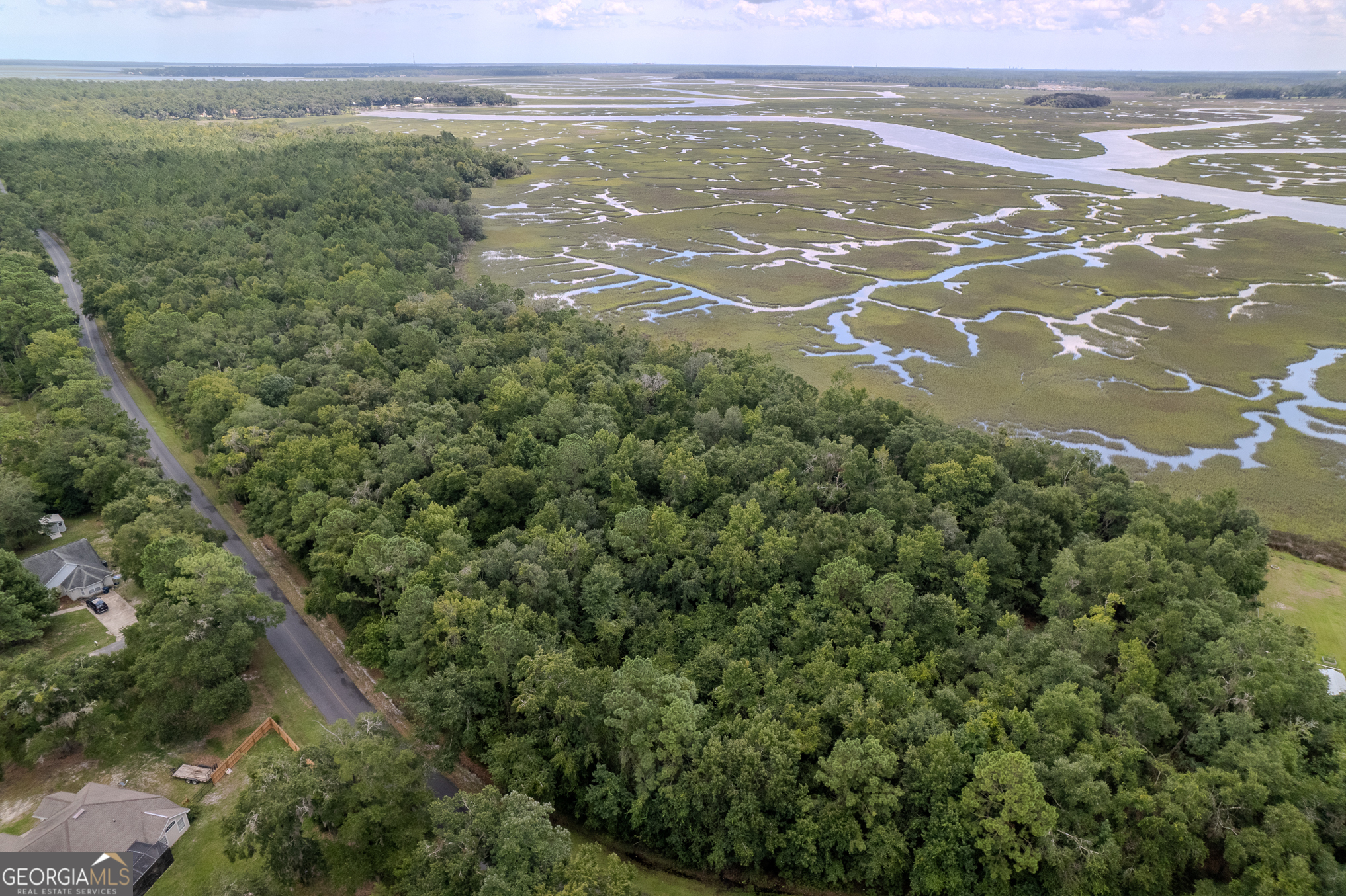 RARE WATERFRONT OPPORTUNITY TO OWN 5.02 ACRES ON CROOKED RIVER, FEATURING 1.16 ACRES OF HIGH GROUND WITH MILES OF STUNNING MARSH AND WATER VIEWS. THIS PROPERTY OFFERS THE BEST OF BOTH WORLDS: SECLUDED PRIVACY WITH THE CONVENIENCE OF BEING LESS THAN THREE MILES FROM I-95 AND EASILY ACCESSIBLE VIA A PAVED ROAD. THE HOMESITE IS SURROUNDED BY MATURE TREES, PROVIDING A NATURAL SETTING AND ENDLESS OPTIONS FOR YOUR FUTURE BUILD. POWER IS CURRENTLY BEING RUN TO THE SITE AND IS INCLUDED IN THE PRICE. THE HIGH-GROUND PORTION LIES IN AN "X" FLOOD ZONE, MEANING NO FLOOD INSURANCE IS REQUIRED. EVEN BETTER: THIS PROPERTY IS OUTSIDE CITY LIMITS, SO YOU'LL SAVE ON CITY TAXES. ALL WATER RIGHTS, MINERAL RIGHTS, OIL, AND GAS RIGHTS CONVEY WITH THE SALE. ADDITIONAL PARCELS, SOME ADJACENT, ARE ALSO AVAILABLE.