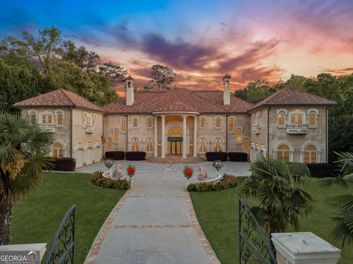 Where Grandeur Meets Glamour! Step into a world where timeless European elegance meets modern splendor. This iconic Spanish Mediterranean masterpiece spans nearly 19,000 finished square feet across three dramatic levels, all tucked behind a gated entry on almost 2 acres of manicured, private grounds. From the moment you enter, prepare to be swept off your feet by the double staircase, soaring 32-foot ceilings, and hand-painted murals by renowned artist Colin Aimsworth. Each ceiling is a work of art, with one-of-a-kind architectural detail in every room, groin vaults, and Venetian plaster finishes that exude pure refinement. Designed for both opulent entertaining and intimate living, this estate features: 10 luxurious bedroom suites, including a main-level ownerCOs wing with a spa-inspired bath. A grand formal living room, ballroom-sized great room, and gentleman's paneled study. A chefCOs kitchen with double islands, stone countertops, high-end Sub-Zero and Viking appliances, and a full Sub-Zero wine cooler. The terrace level is an entertainerCOs dream with a home theater, billiards room, private gym, wine cellar, and show-stopping bar that flows into a versatile party-ready space. Outside, you'll find your own private resort complete with: A heated saltwater Italian tile pool adorned with a custom medallion, an outdoor kitchen, lush landscaping creating a secluded sanctuary for year-round enjoyment. Car collector or auto enthusiast? The 6-car garage easily fits up to 12 vehicles with lift kits and is as immaculate as the interiors. Prefer the convenience of an elevator? The home is elevator-ready for seamless access to all levels. But what truly sets this estate apart? Its star quality. This residence is not just a homeCoitCOs a working piece of Hollywood history. Featured in major motion pictures, TV series, and commercials like Creed III, this palace doubles as an income-producing film and television location. The seller is open to lease purchase options for the right buyer, creating an exceptional opportunity and unmatched opportunity in the luxury home space. This isnCOt just a houseCoitCOs a #MovieMansion. For those who desire prestige, privacy, and a property thatCOs truly unforgettable, 720 Heards Ferry Road delivers all that and more.