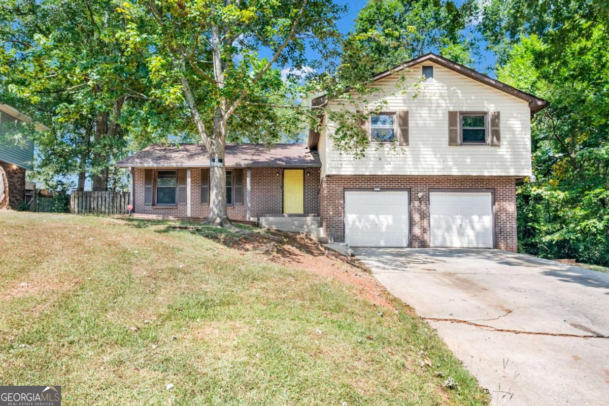 Incredible Opportunity in Jonesboro! Whether you're looking for your next investment or a forever home, 1598 Flicker Rd has it all. This spacious 4-sided brick beauty features 4 bedrooms and 2.5 baths, including a basement with a bonus room that can be used as a bedroom, half bath, and private exterior access - perfect for multigenerational living or rental income. Enjoy hardwood floors throughout, a sunroom for relaxing, a large equipped kitchen, formal dining room, and your very own in-ground pool ready for summer fun! The property sits on a full 1-acre lot (adjacent lot included in the sale), giving you space to grow, garden, or build. With an attached garage and easy access to shopping, dining, and major highways, this home offers versatility, value, and serious potential. Don't miss your chance to own a property that fits both lifestyle and investment goals! Some photos have been virtually staged to illustrate potential furniture placement, the home is not currently furnished as shown.