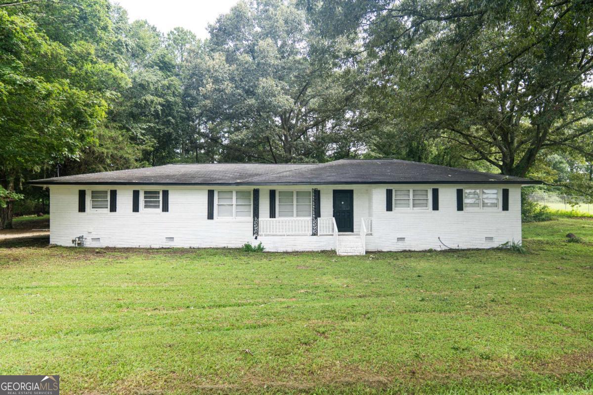 1.11+/- acres of level property surrounded by property within the City Limits of Carrollton. This property is zoned Agricultural in the County. The home is a four sided brick ranch with 3 bedrooms and 1.5 bath. New paint, kitchen cabinets, new LVP flooring throughout and new plumbing supply lines added. There is a storage building/workshop with a concrete floor in the backyard. This property is located less than 1 mile to the Greenbelt access along Kingsbridge Rd. and approx. 1.5 miles from Downtown Carrollton.