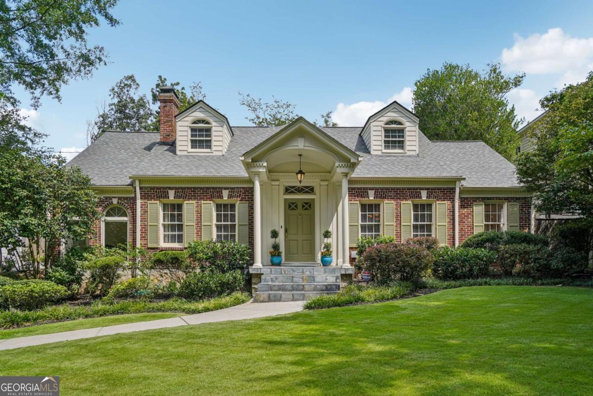 Welcome to a truly handsome Morningside residence featuring a rare Coachhouse-a legal duplex that offers endless possibilities. The well-maintained Coachhouse includes a spacious living and dining area, two cozy bedrooms, a screened porch, a fully equipped kitchen, a full bath, and a separate laundry room. It could serve as a home office or stuido, a comfortable space for in-laws, au pairor/ Nannie Suite or even a rental opportunity. The main house is full of classic charm and character, featuring large rooms, high ceilings, and beautiful hardwood floors throughout. Enjoy a large living room and fireplace, a bright sunroom, an oversized dining room, and a charming breakfast room. The main level also includes a kitchen, a cozy den, and two additional bedrooms, both with en-suite bathrooms. The entire second floor is a dedicated, spacious primary suite. The main house also includes a dry basement, ideal for multiple uses or expansion. Between the main house and the coach house, you'll find a private patio area and lush gardens. An oversized two-car garage provides ample storage. This entire property is in excellent condition and ready for its new owners.