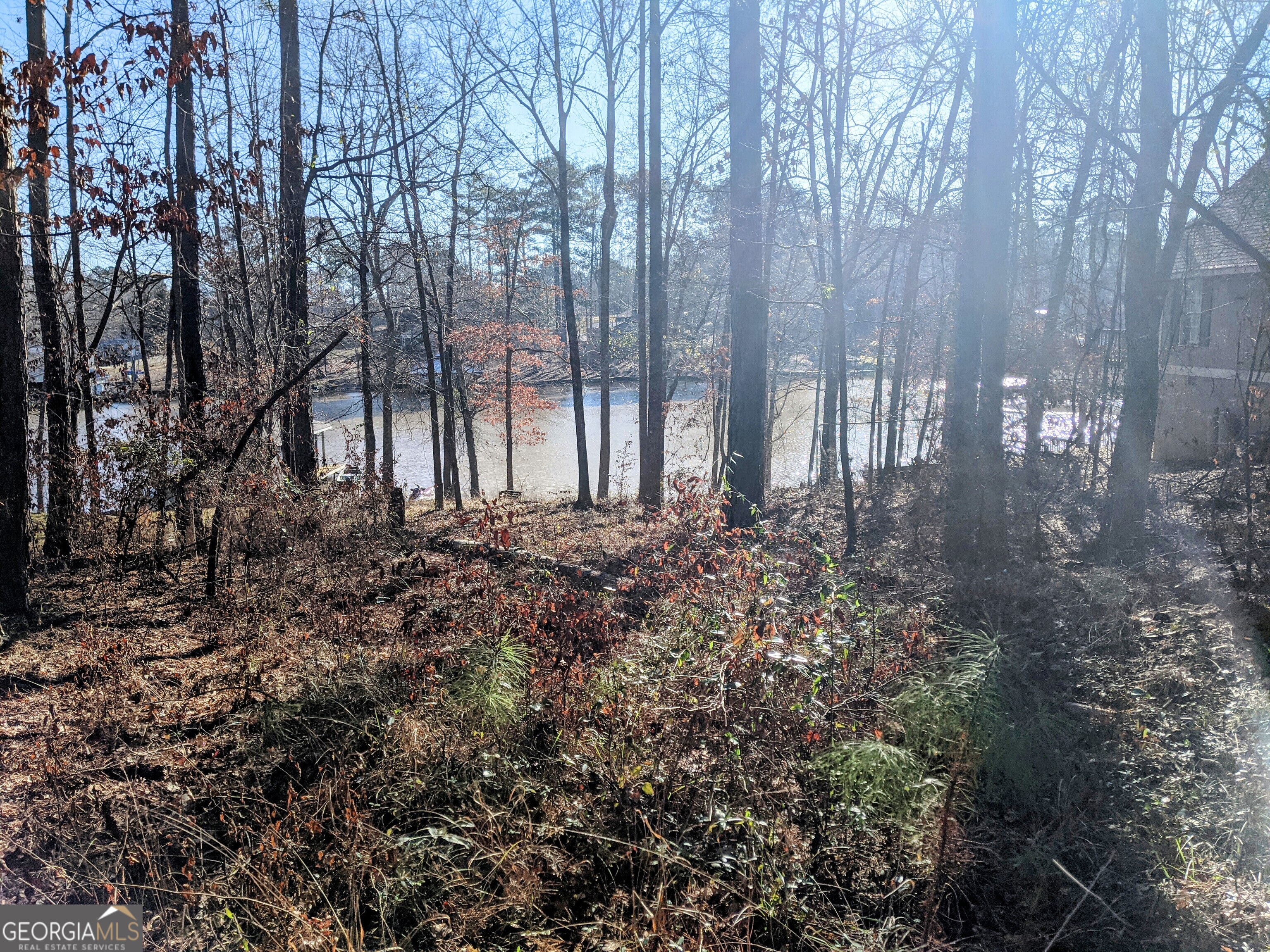 Is lake living your dream? This lot can make that dream come true. This is a sloped lot and unimproved. This is a quick commute to Eatonton, Gray, Milledgeville, Macon or Madison. Located just off of Hwy 129 and Hwy 212. This is a fee simple lot. No lease strip. Site built only. Minimum of 900 square ft home. Owner financing available. 10% down and will finance up to 30 years. Motivated seller. Bring ALL Offers!