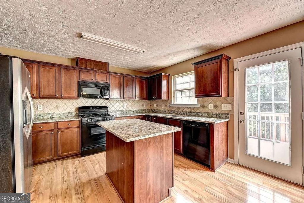 Photo of 670 Roxford Ln, Buford, GA 30518 (MLS # 10660889)