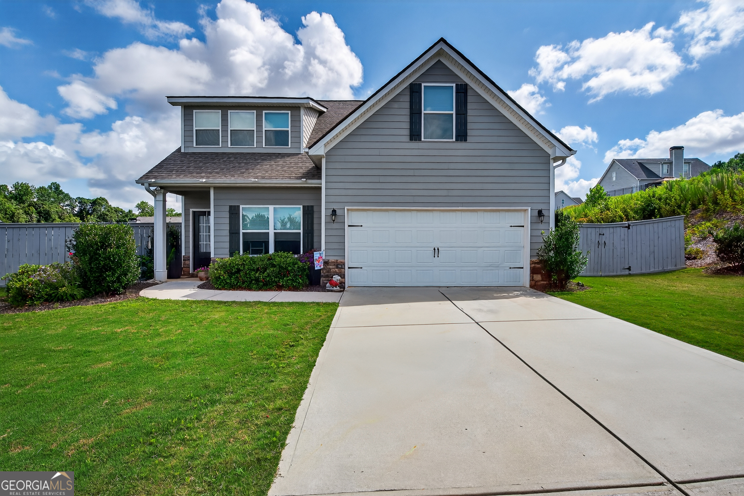 Welcome to this well-kept 4 bedroom, 2.5 bathroom home in the established Huntington Manor neighborhood. The primary suite is located on the main level with a private en suite bath, while three additional bedrooms are upstairs - perfect for families or guests. The home features a spacious layout, plenty of natural light, and a fenced-in backyard ideal for pets, play, or entertaining. One of the standout features is the enclosed sunroom with large windows, offering the perfect spot for a playroom, second living area, or peaceful indoor-outdoor retreat. Located in a quiet, mature community with easy access to schools, shopping, and dining. Don't miss your chance to own a move-in ready home in one of the area's most desirable neighborhoods!